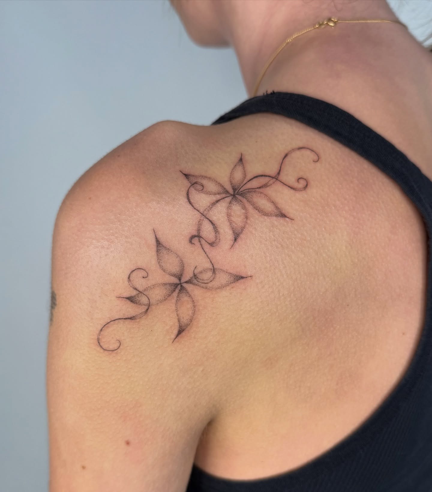 Floral design black and grey tattoo on the shoulder by Soomin