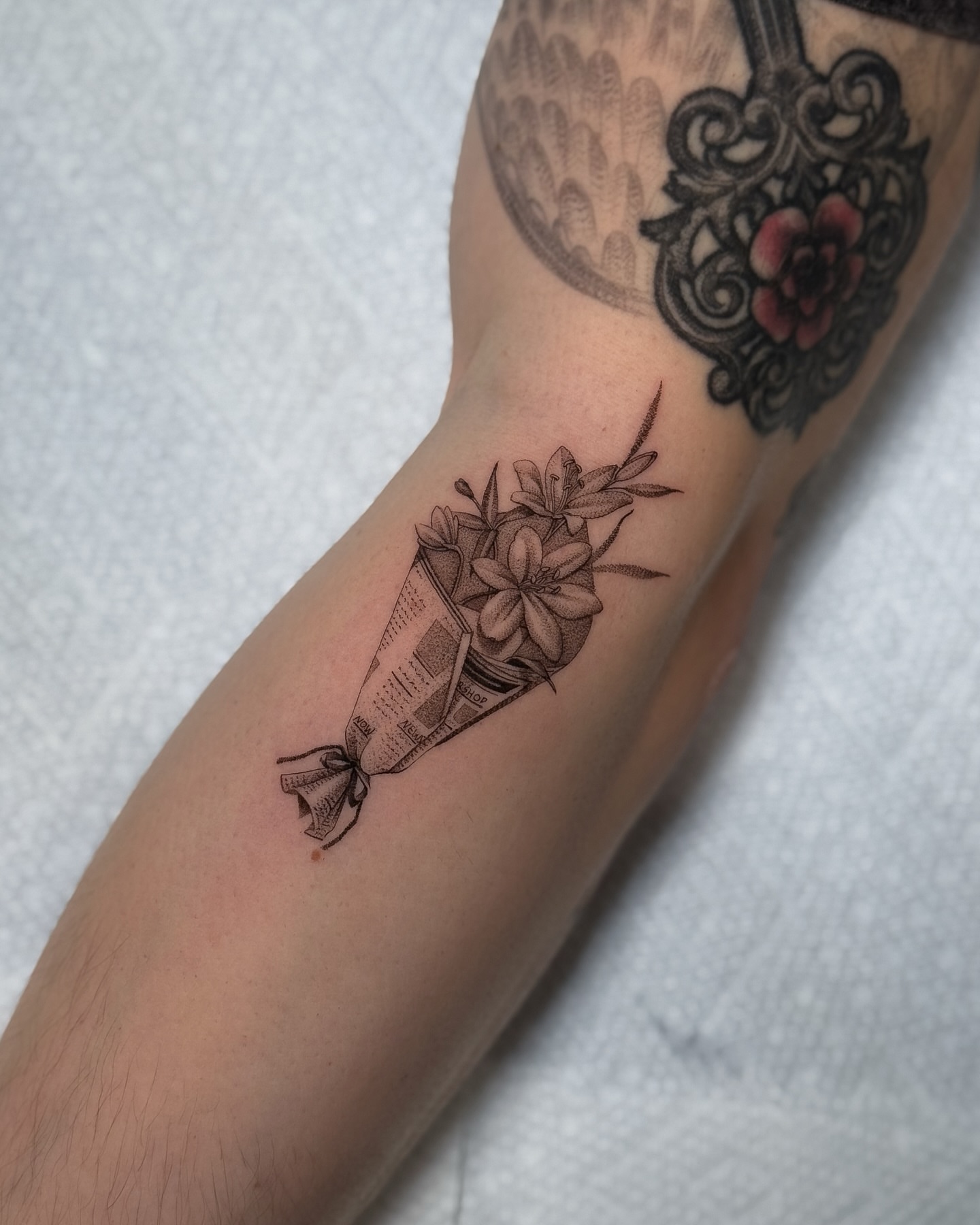 Candy wrapper with flowers black and grey tattoo on the forearm by ♡ 𝕍𝕚𝕔𝕥𝕠𝕣𝕚𝕒 ℍ𝕠𝕝𝕞𝕖𝕤 ♡, Avon, Ohio