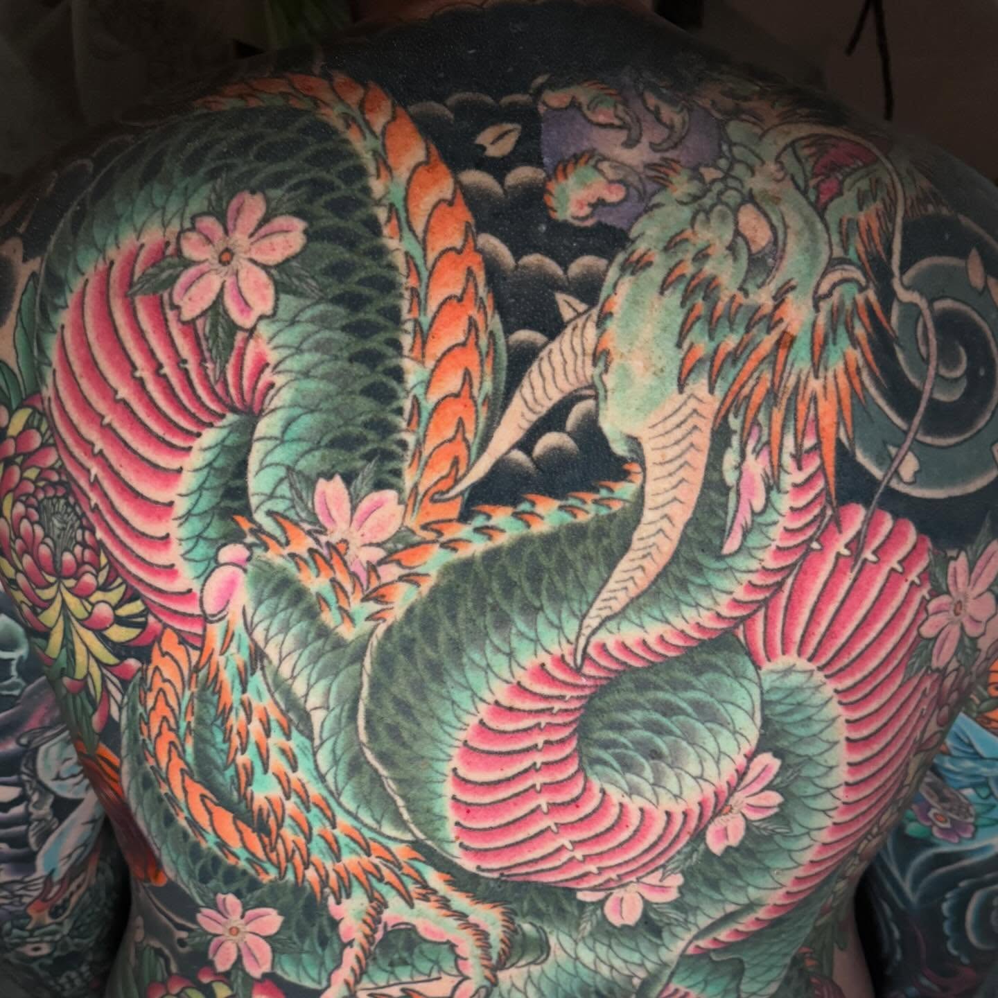 Dragon and flowers japanese irezumi tattoo on the back by Mike Diamond