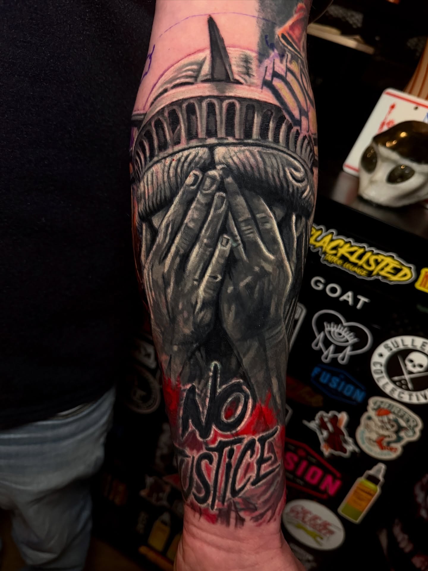 Statue of liberty realism tattoo on the forearm by Scott Pizer