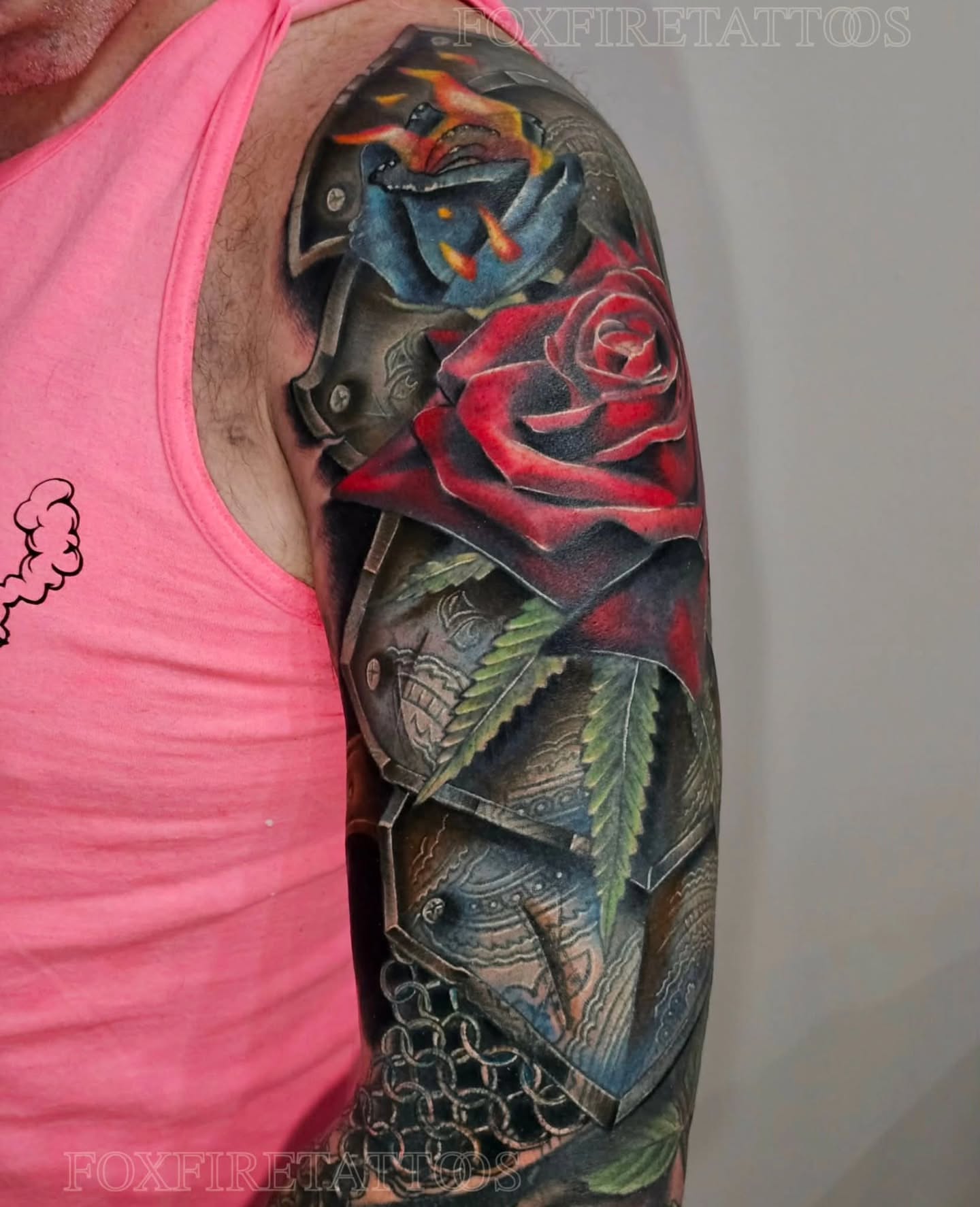 Red rose and mechanical elements realism tattoo on the upper arm by Lindsey Chevalier - KCMO TATTOO ARTIST