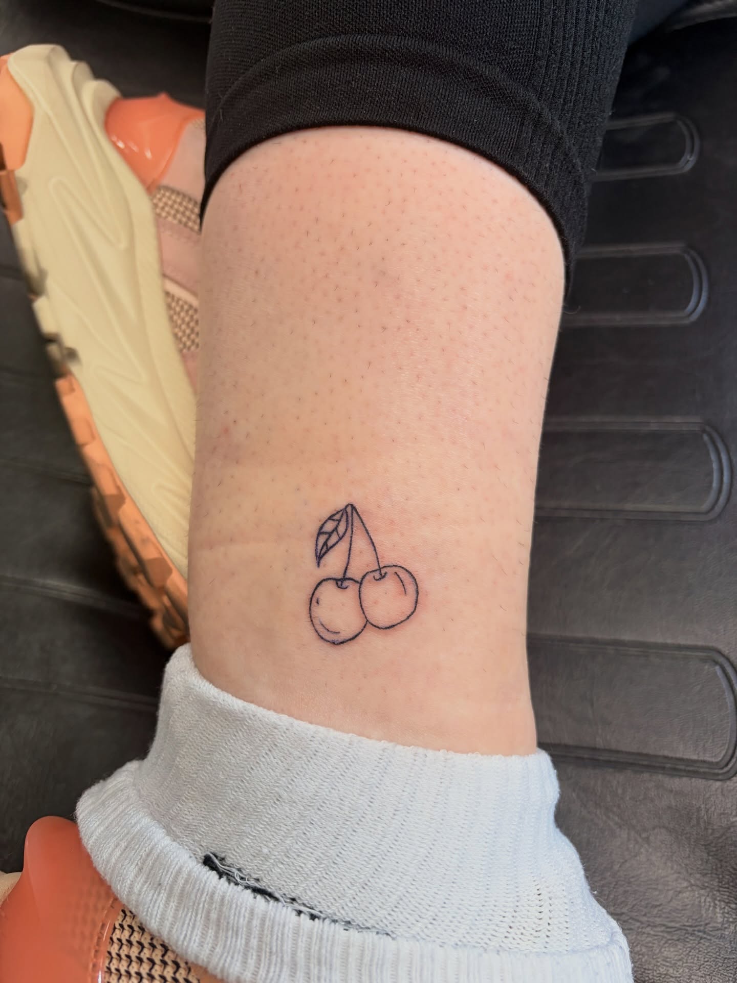 Cherries minimalist tattoo on the forearm by Inky Birdz Tattoos