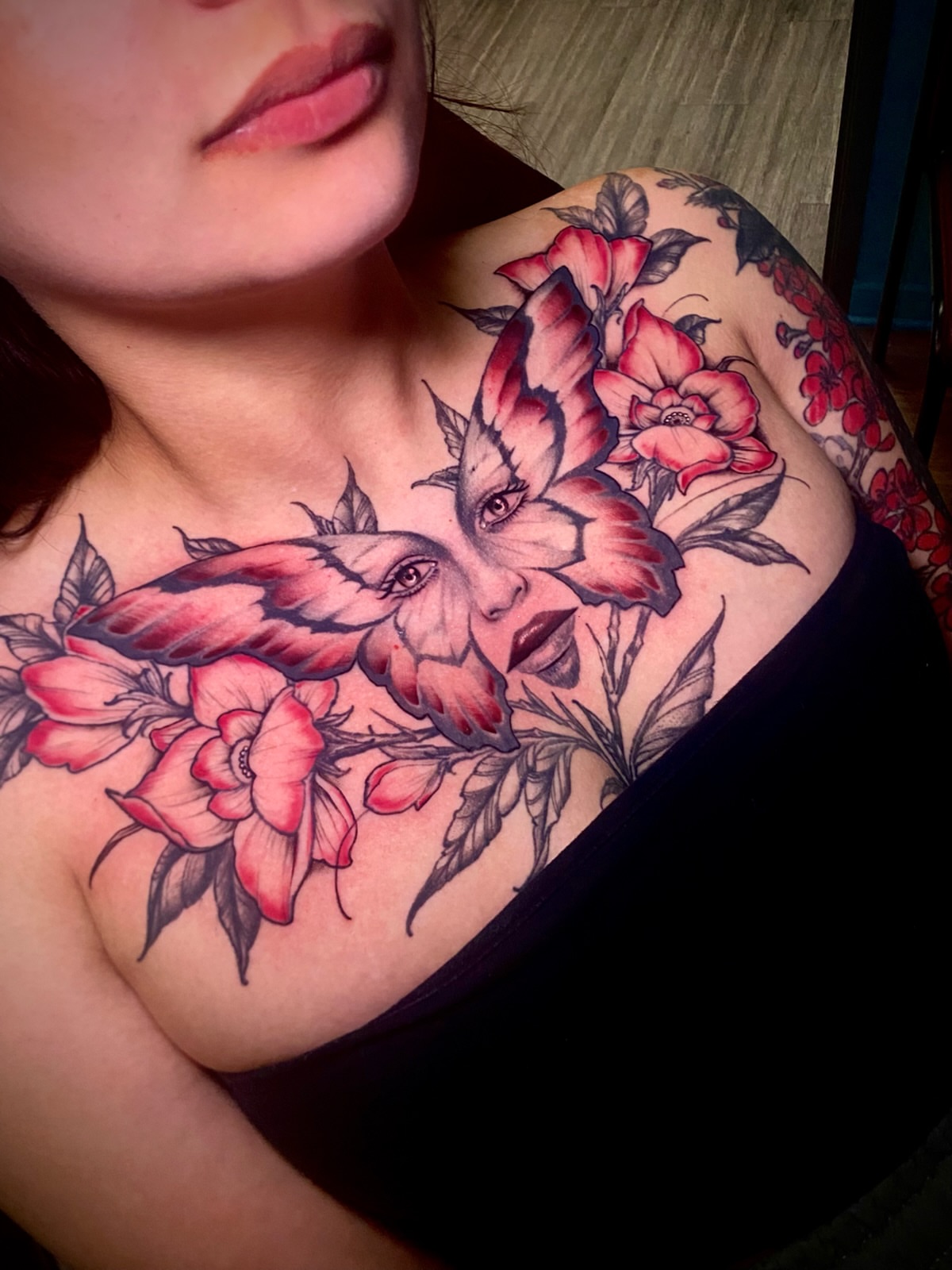 Floral portrait realism tattoo on the chest by Adam Newton