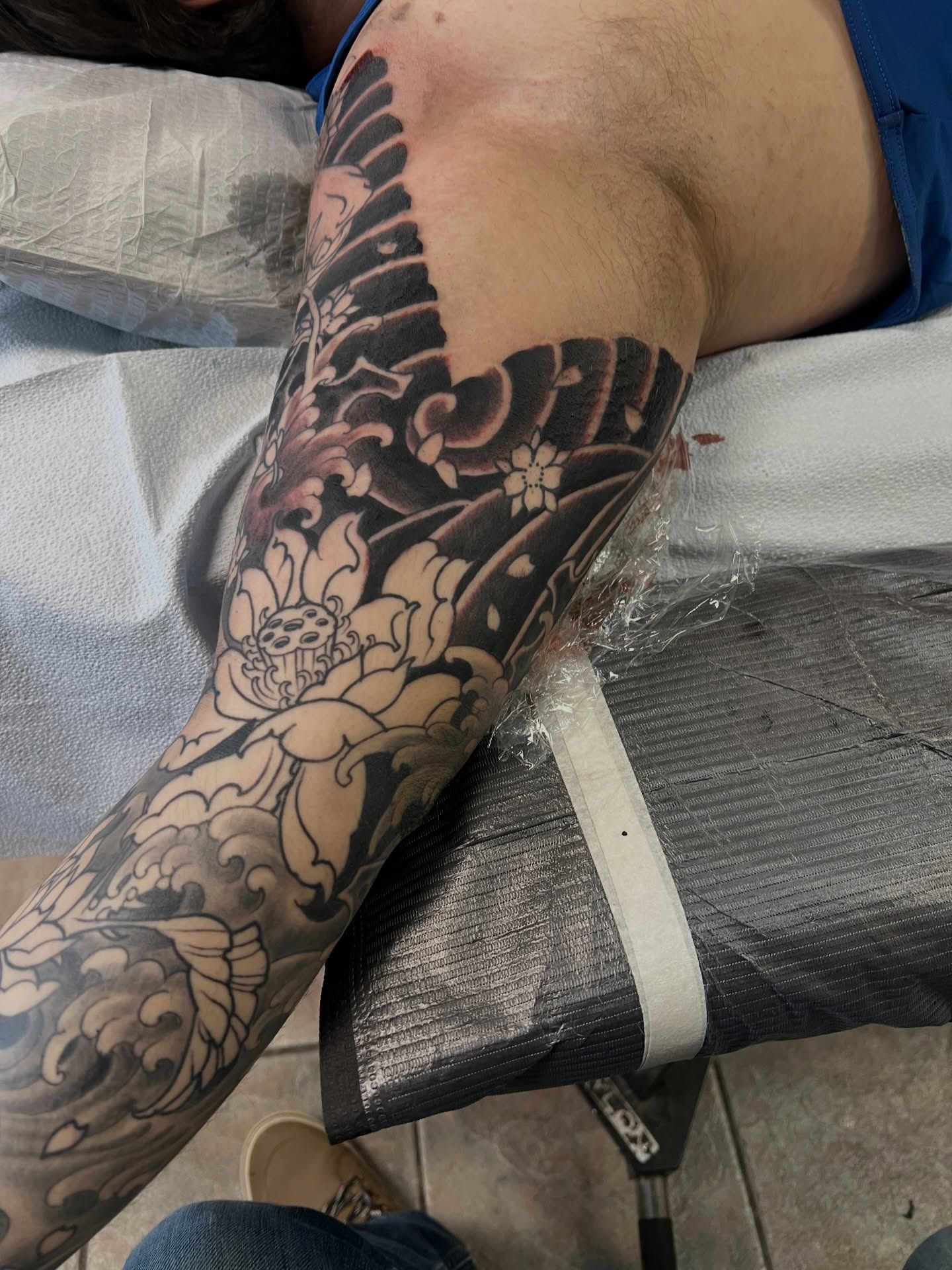 Lotus flowers and waves japanese irezumi tattoo on the forearm by Corey Thompson, Butler, Pennsylvania