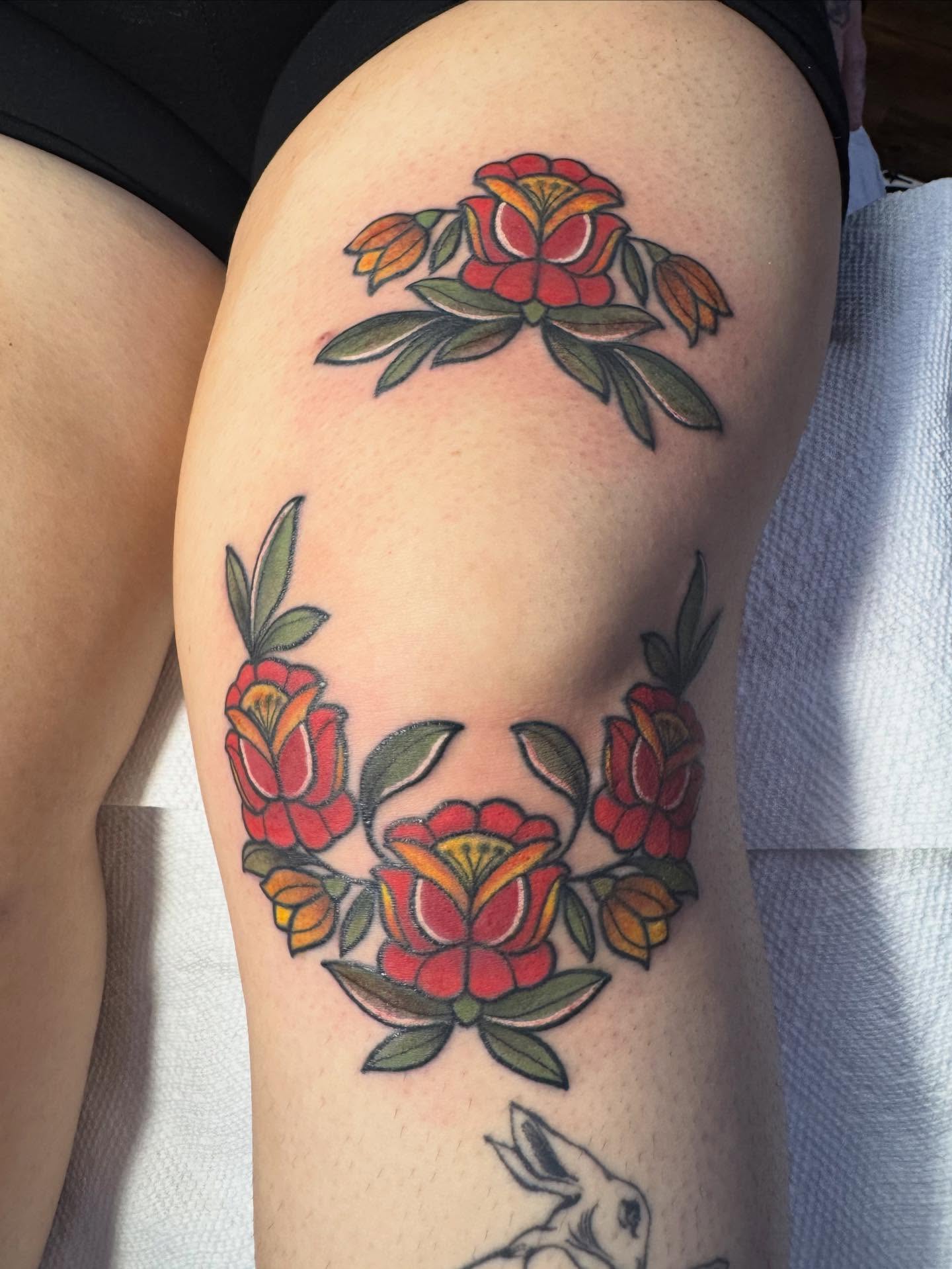 Floral wreath American traditional tattoo on the thigh by ️️️️️Hannah Smyle
