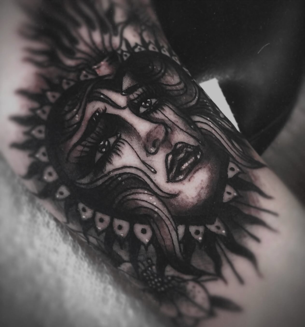 Woman's face American traditional tattoo on the forearm by Alle