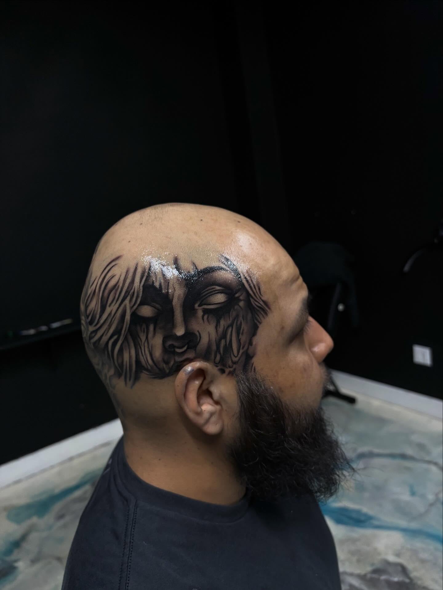 Face black and grey tattoo on the head by Jay Daartist