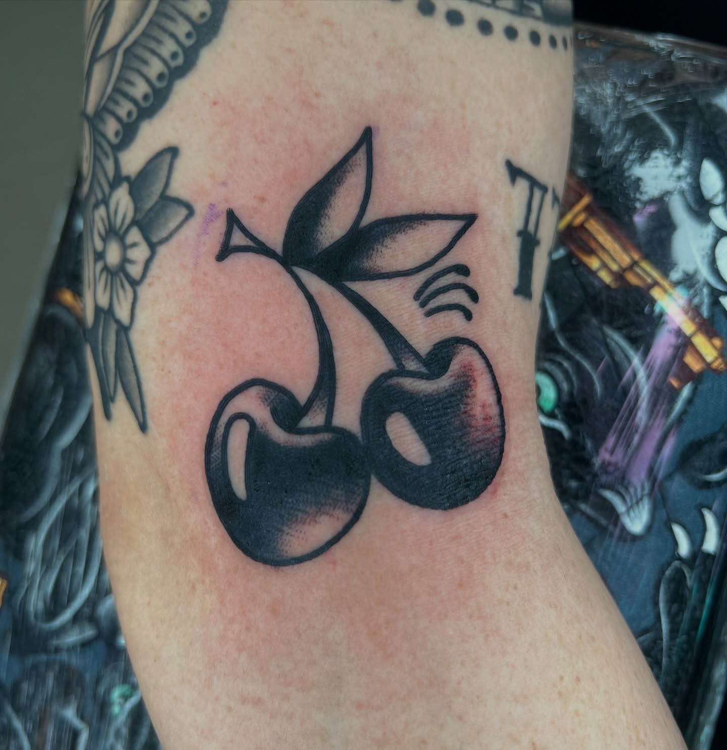 Cherry pair dotwork tattoo on the forearm by Like A Horse Corral
