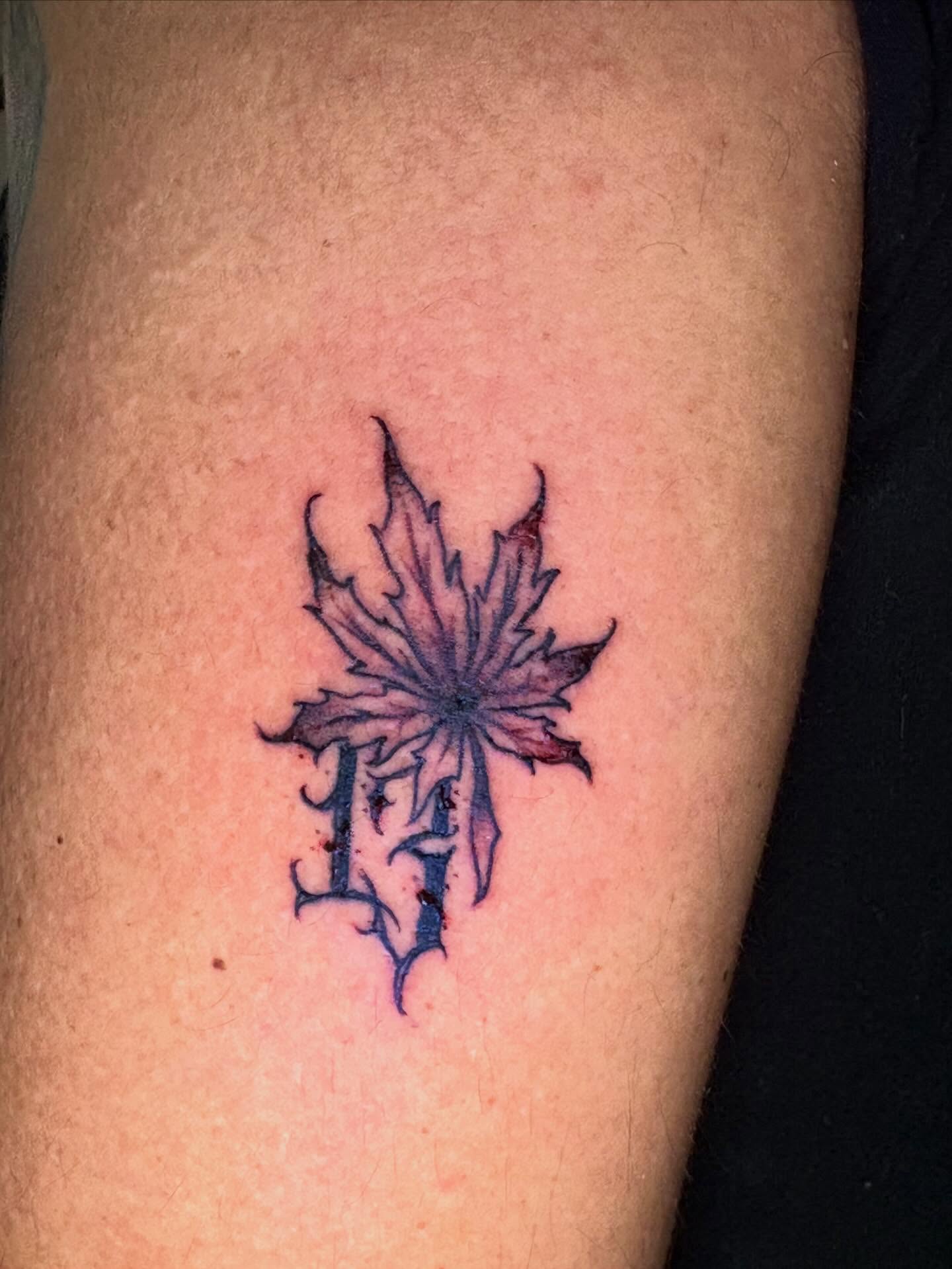 Maple leaf American traditional tattoo on the forearm by Eddie Wolfe