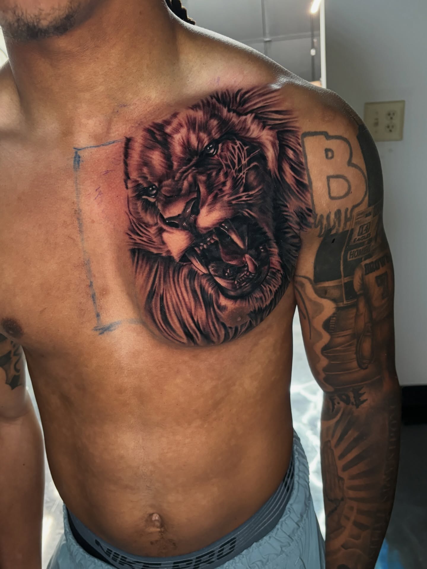 Lion realism tattoo on the chest by Vonte Seay