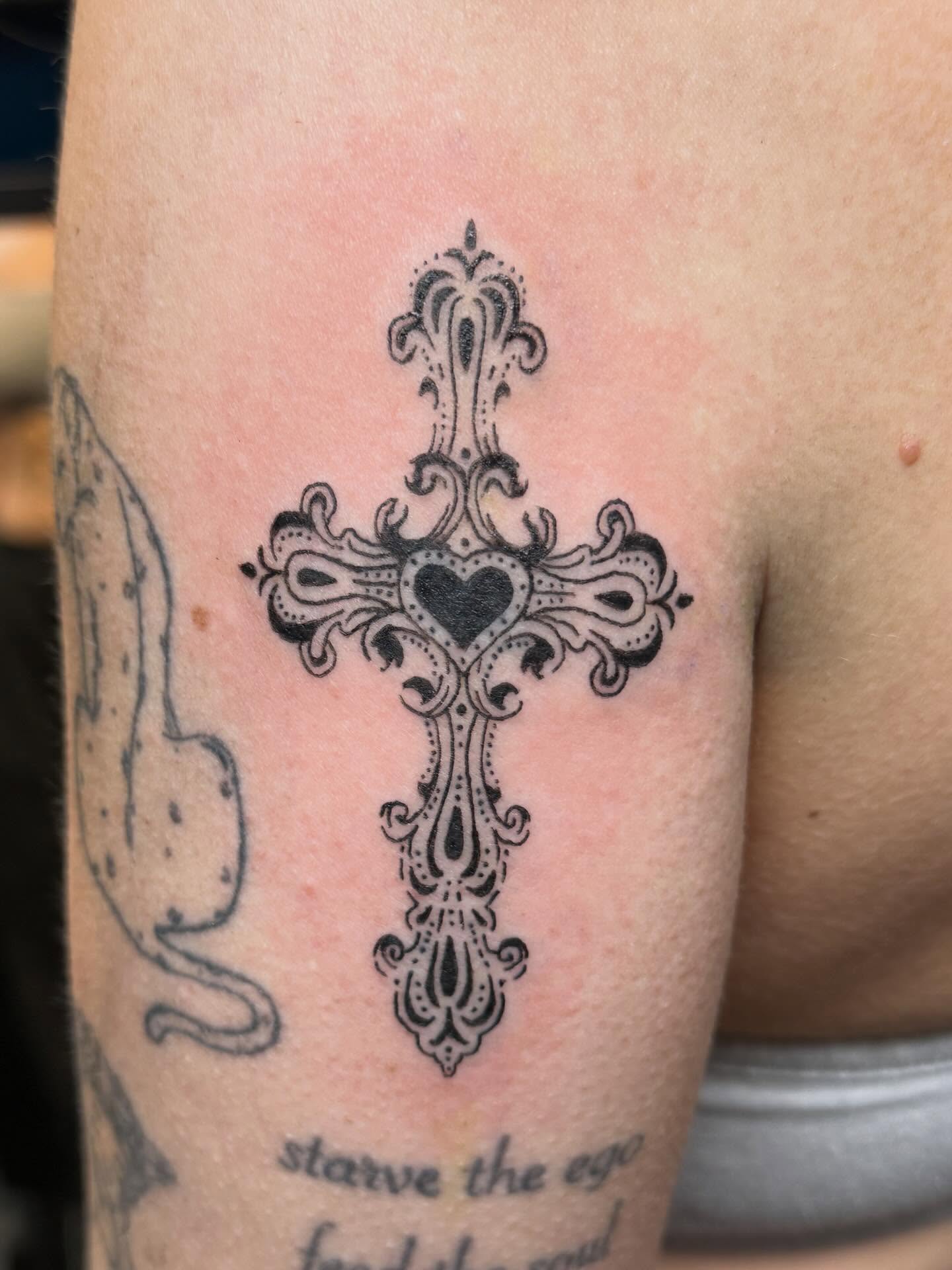 Cross ornamental tattoo on the forearm by Elena