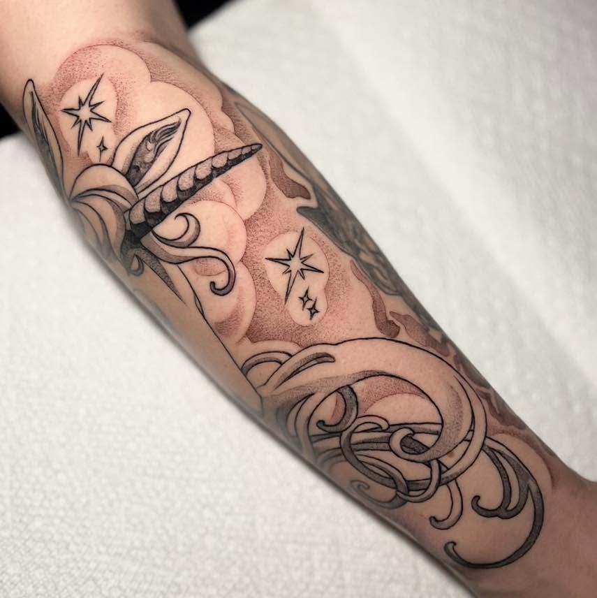 Octopus and stars dotwork tattoo on the forearm by Haylie Adele Strong