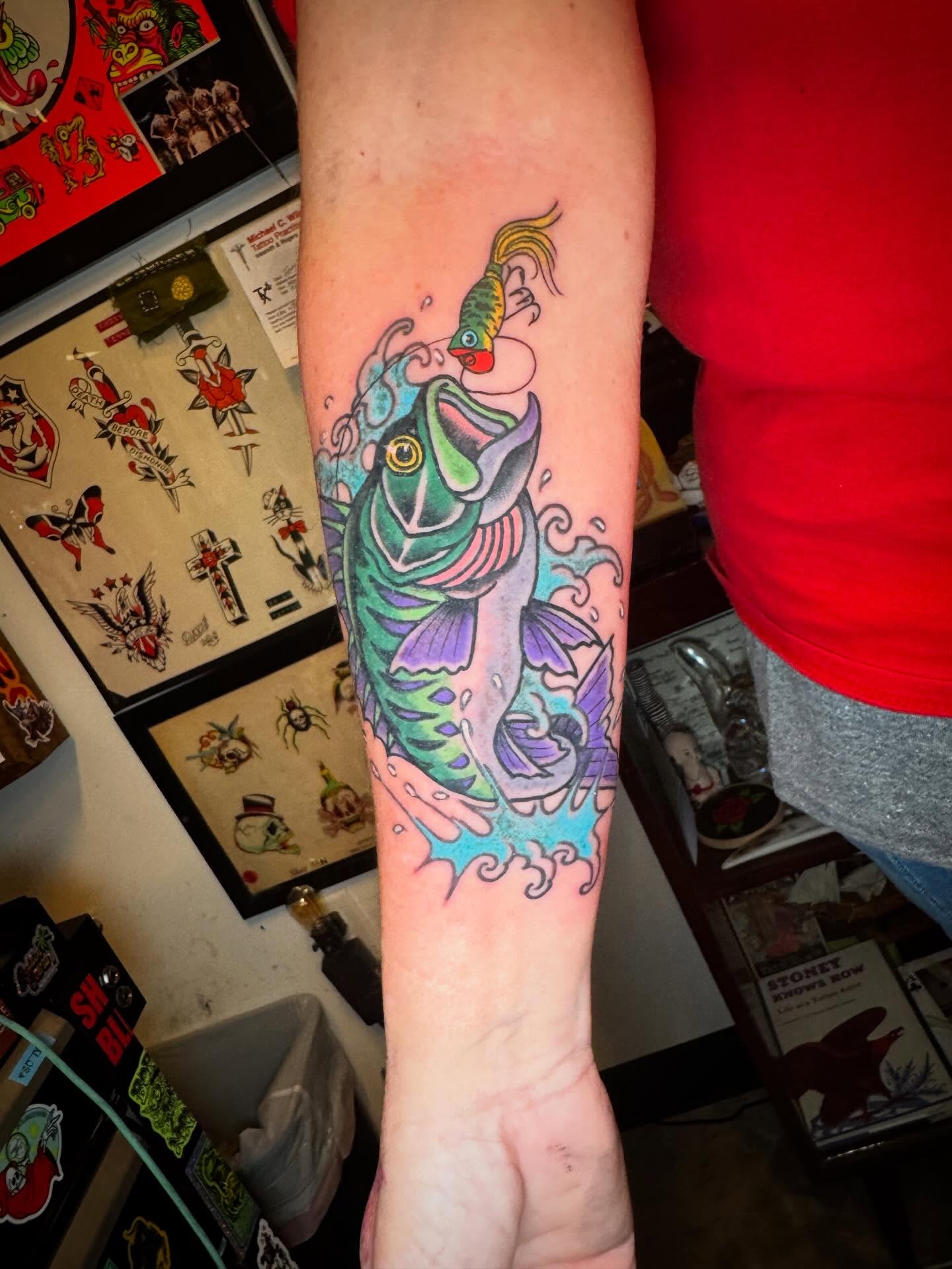 Koi fish American traditional tattoo on the forearm by j Smalley