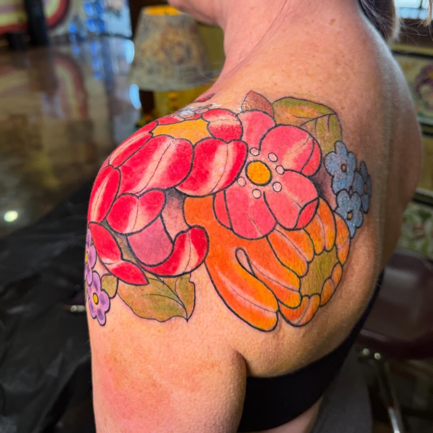 Floral bouquet new school tattoo on the shoulder by Erin McDavis