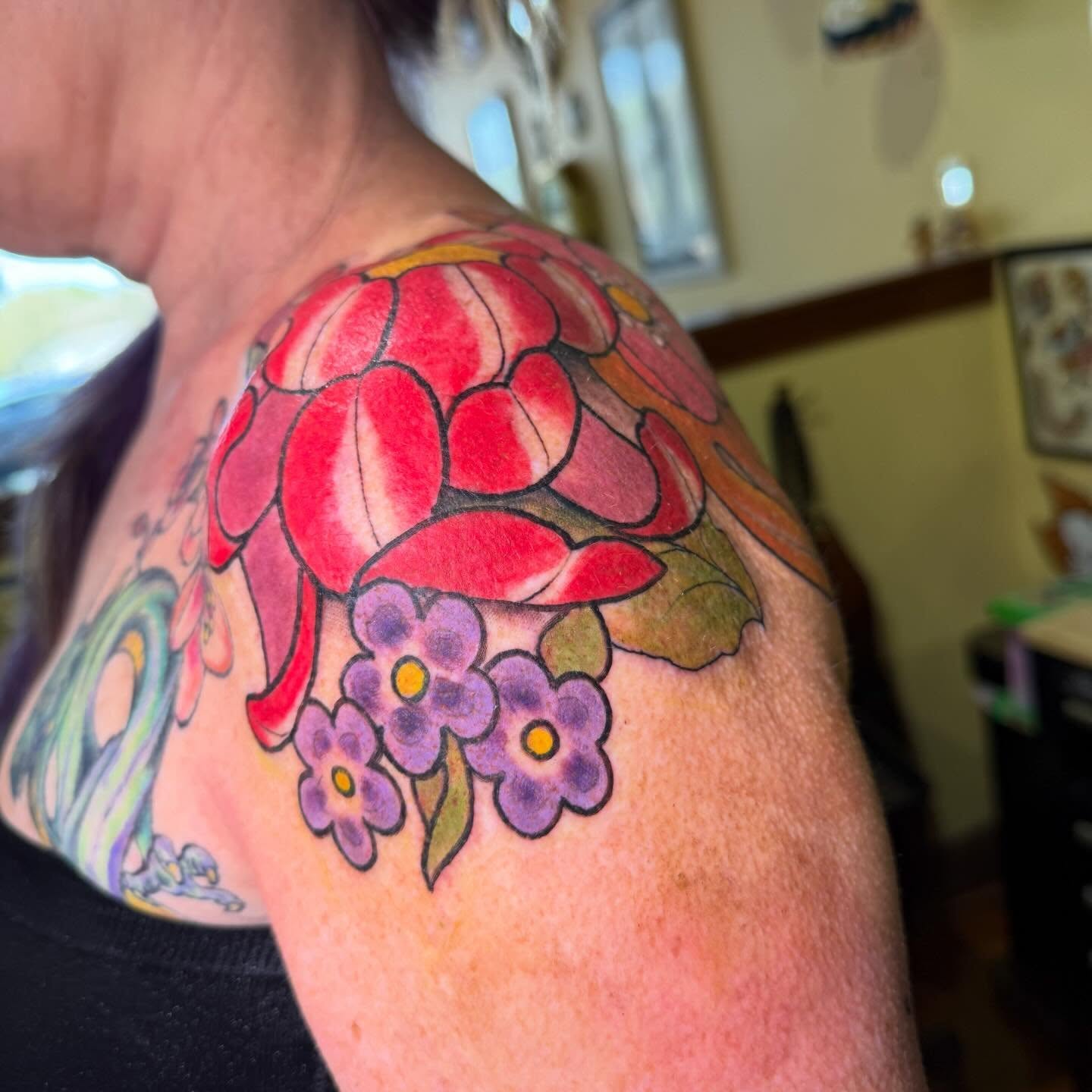 Floral bouquet American traditional tattoo on the shoulder by Erin McDavis