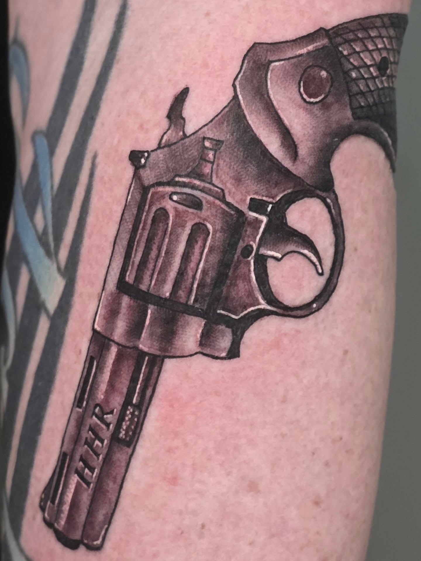 Revolver black and grey tattoo on the forearm by Steve Atkinson Tattoo Artist