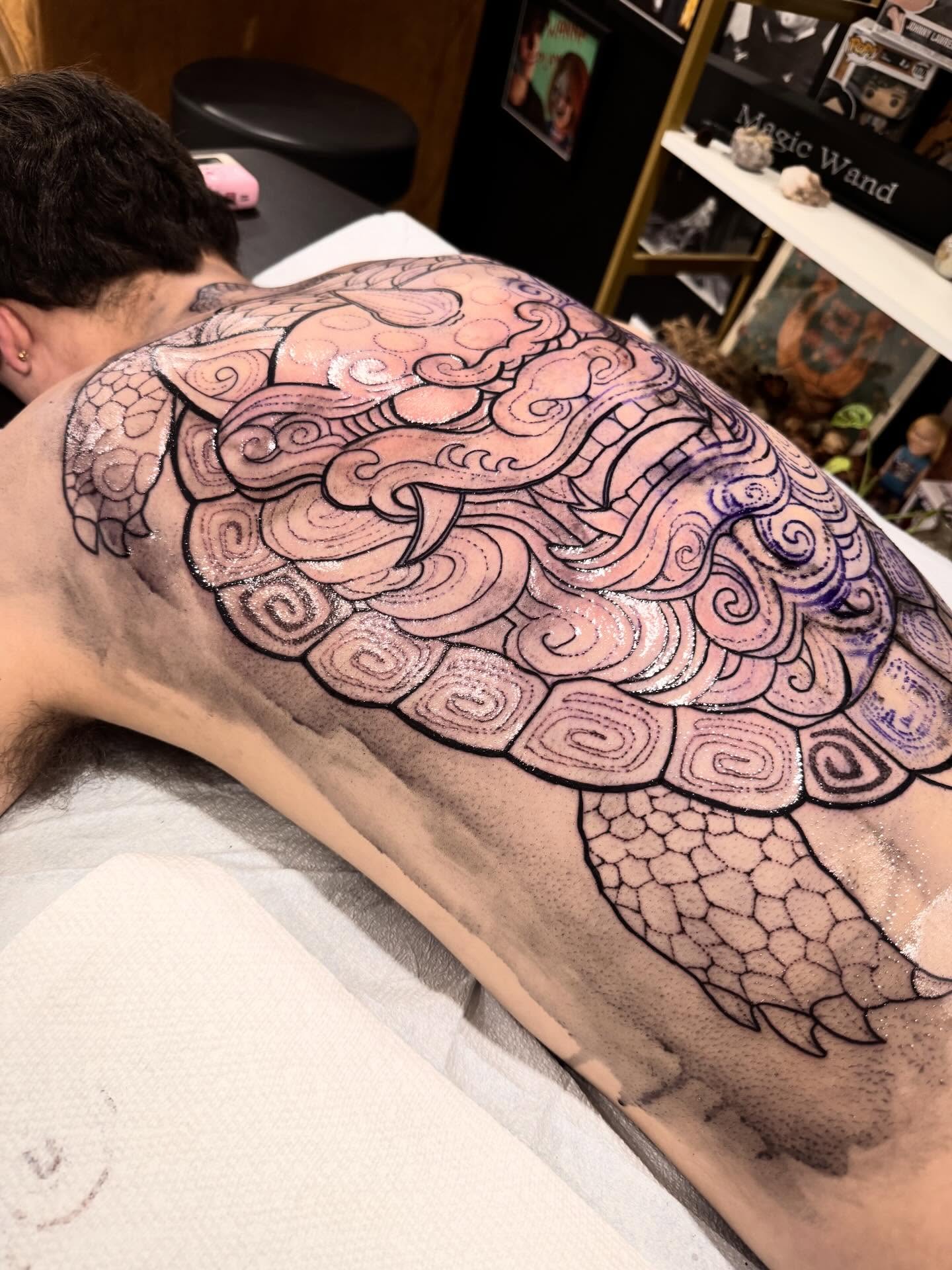 Turtle geometric tattoo on the back by Shannon Misitano
