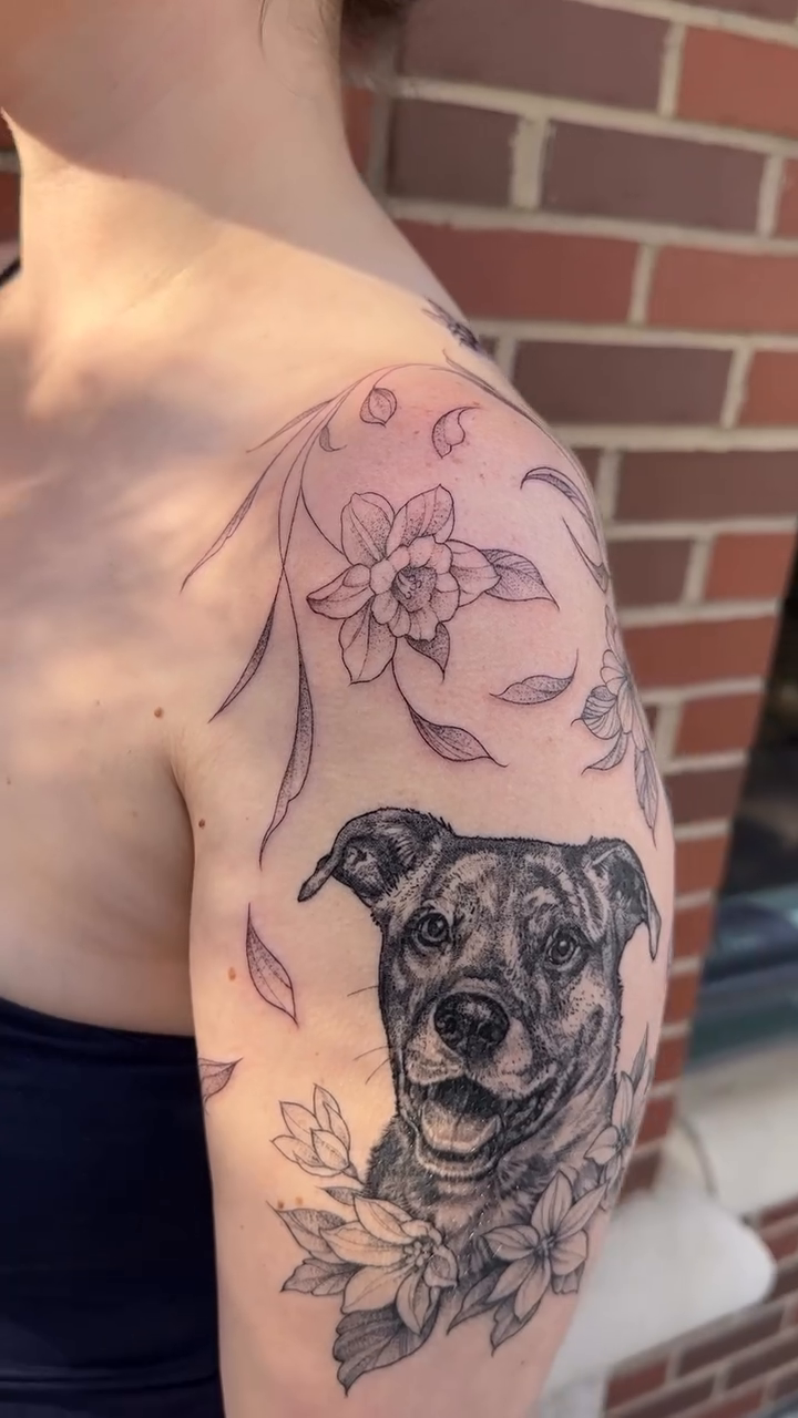 Dog portrait with flowers realism tattoo by Robert McCollum