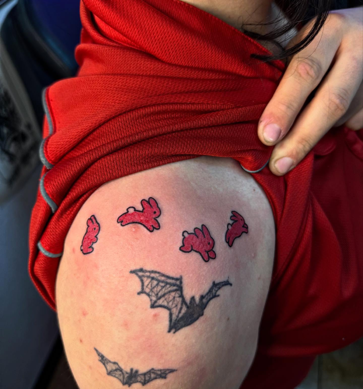 Bat and rabbits trash polka tattoo on the thigh by McKenna Hughes