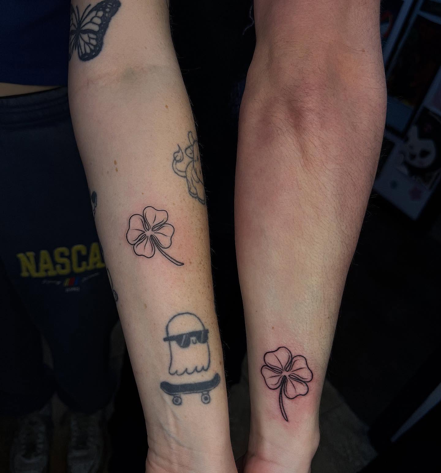 Clover black and grey tattoo on the forearm by McKenna Hughes