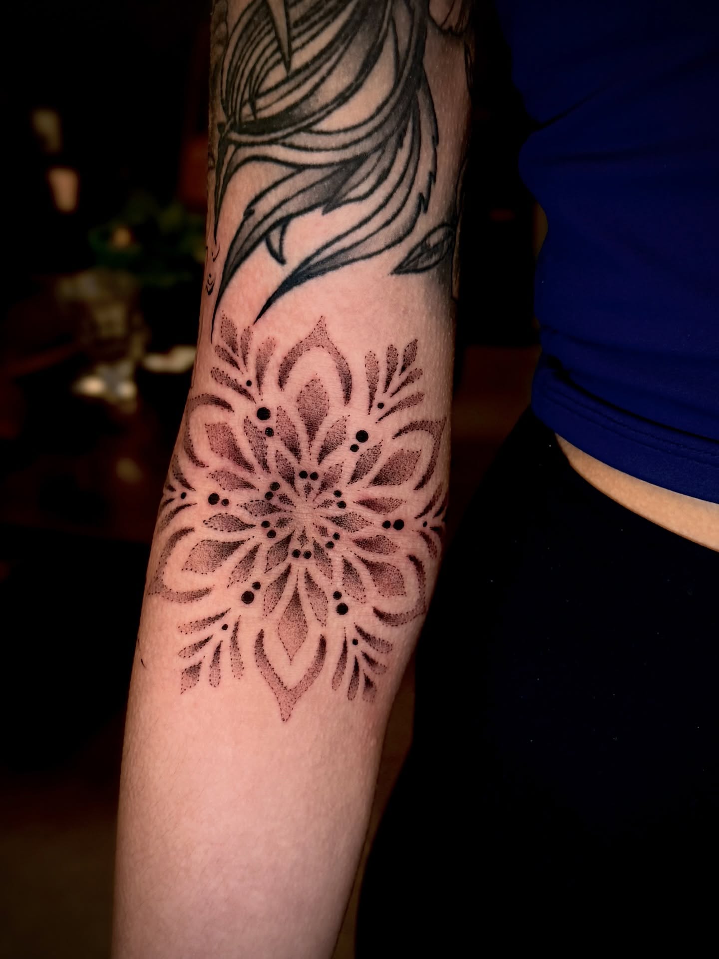 Floral mandala dotwork tattoo on the forearm by Thomas Martinez