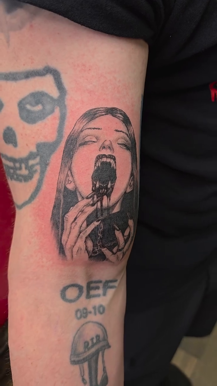Woman with gun in mouth realism tattoo on the forearm by Bosco Layne