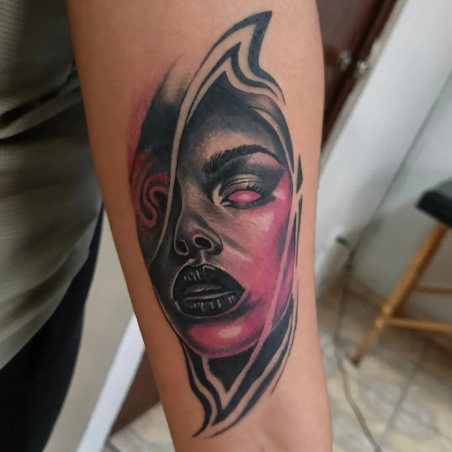 Woman's face realism tattoo on the forearm by Alexander Tattooink