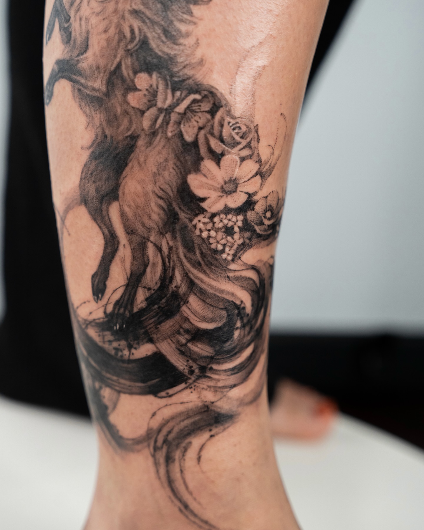 Unicorn and flowers realism tattoo on the forearm by Tri