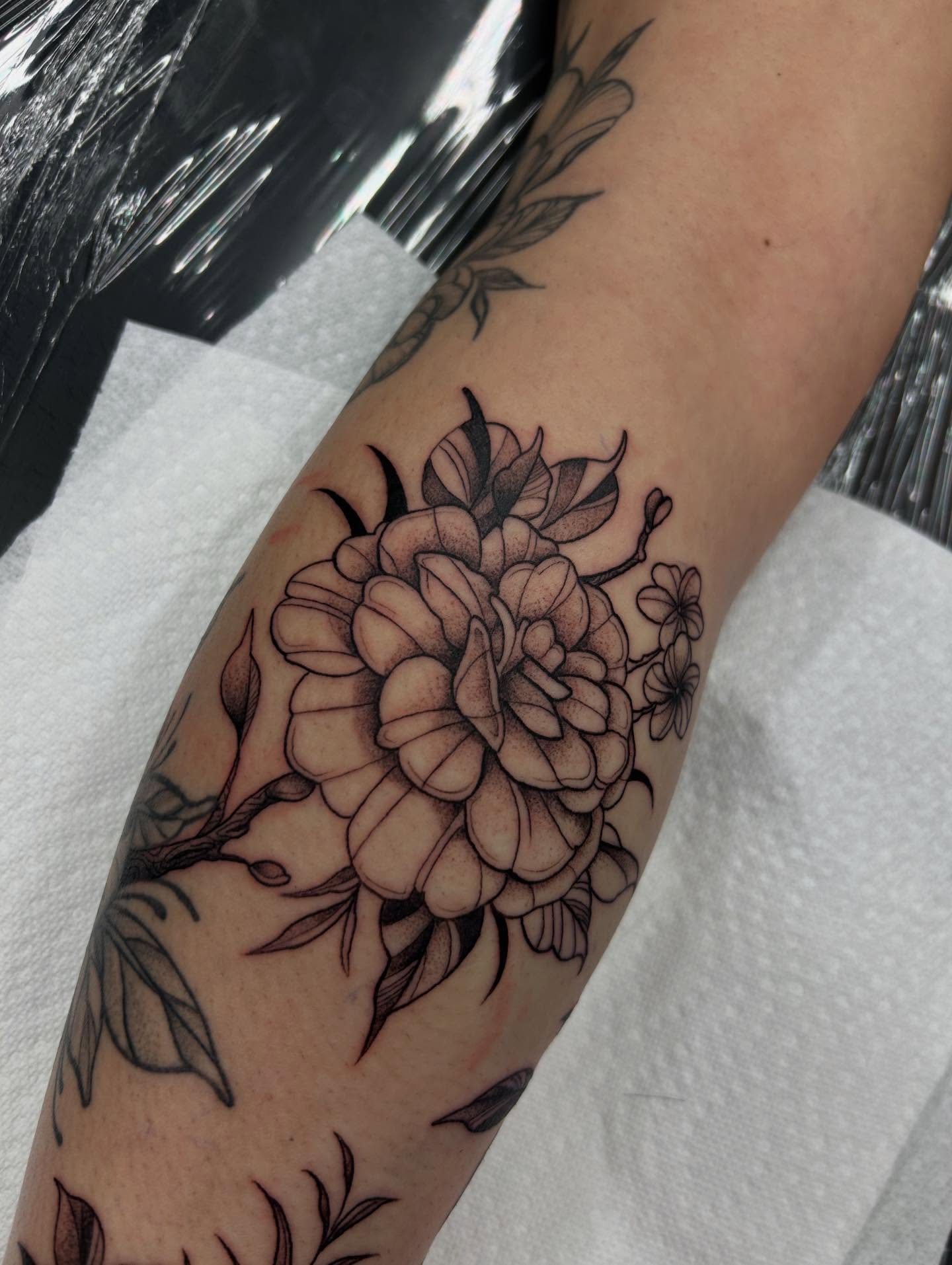 Peony black and grey tattoo on the forearm by Livy baby