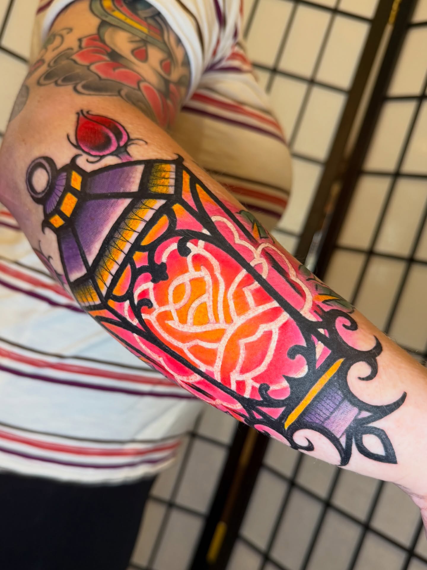 Lantern and floral American traditional tattoo on the forearm by Kevin R. Onley