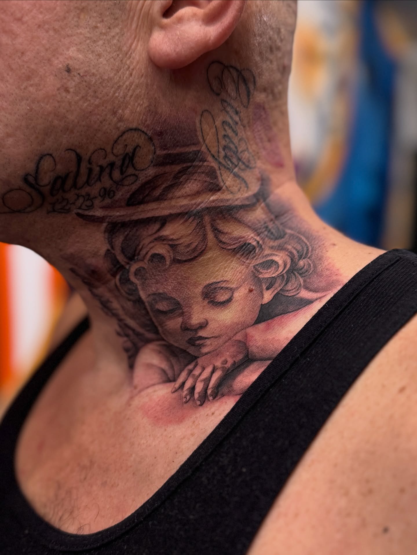 Sleeping cherub realism tattoo on the neck by tombstone