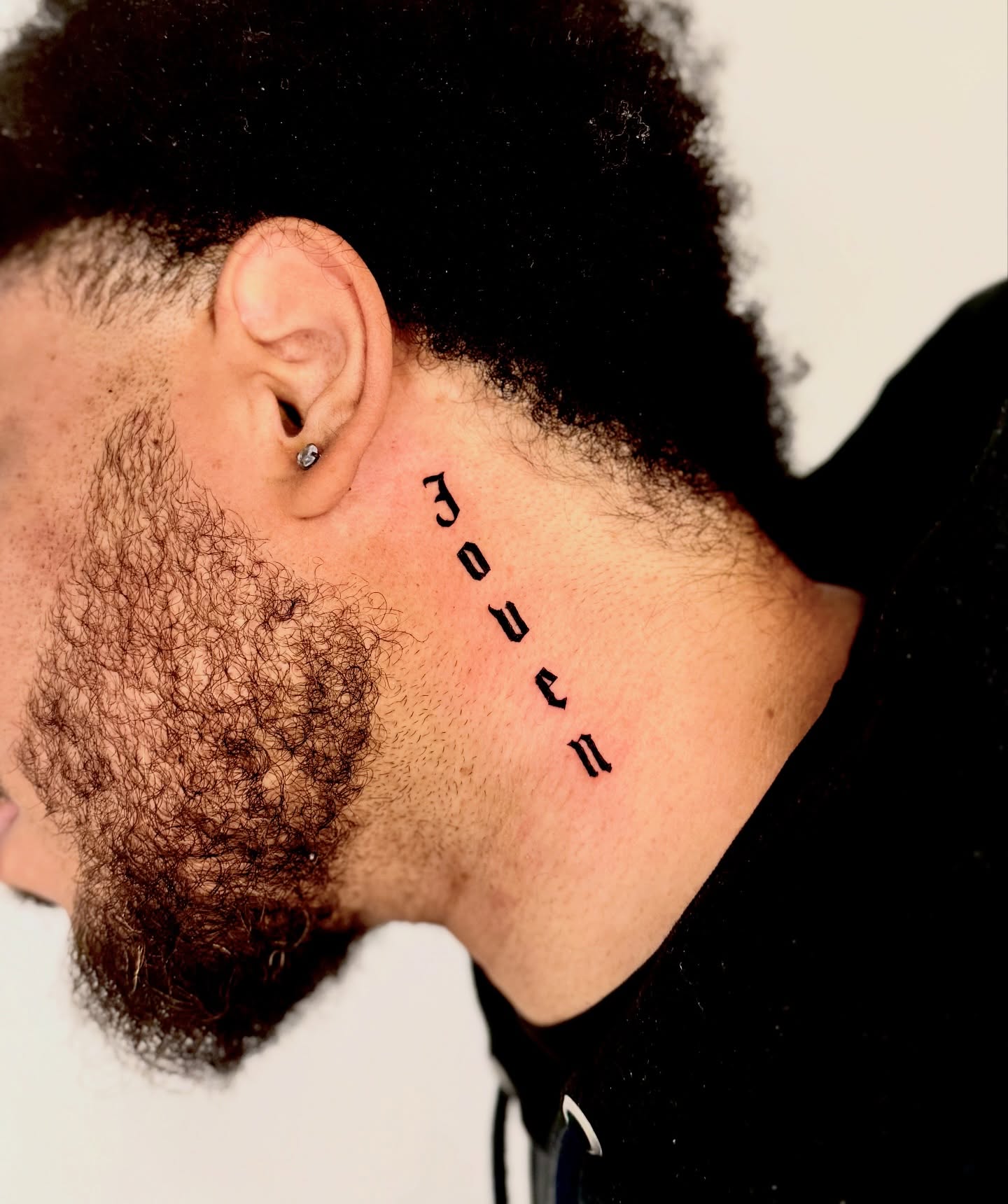 Joven lettering script tattoo on the neck by Orca