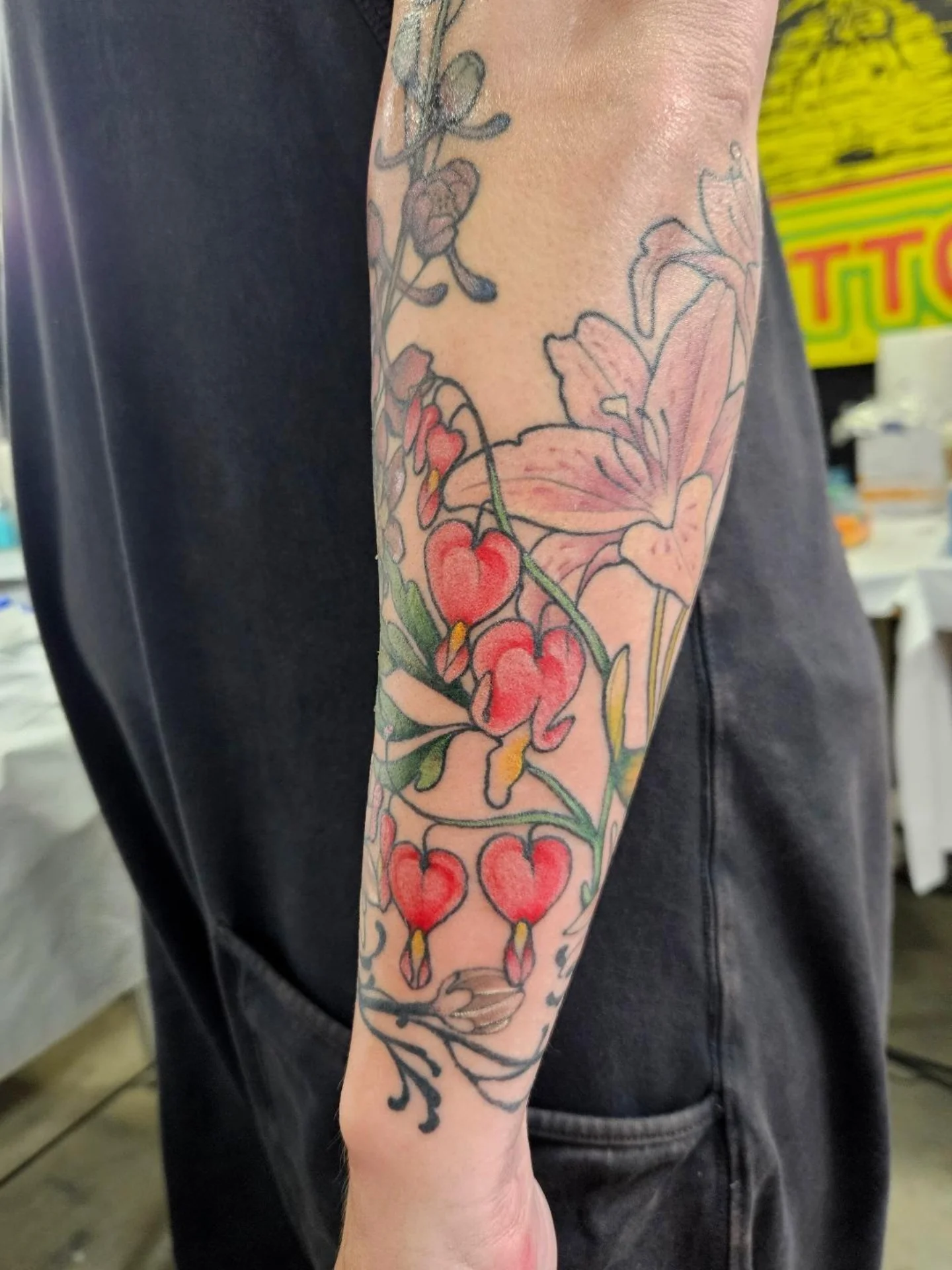 Flowers and hearts new school tattoo on the forearm by Ayla Stone, Salt Lake City, Utah