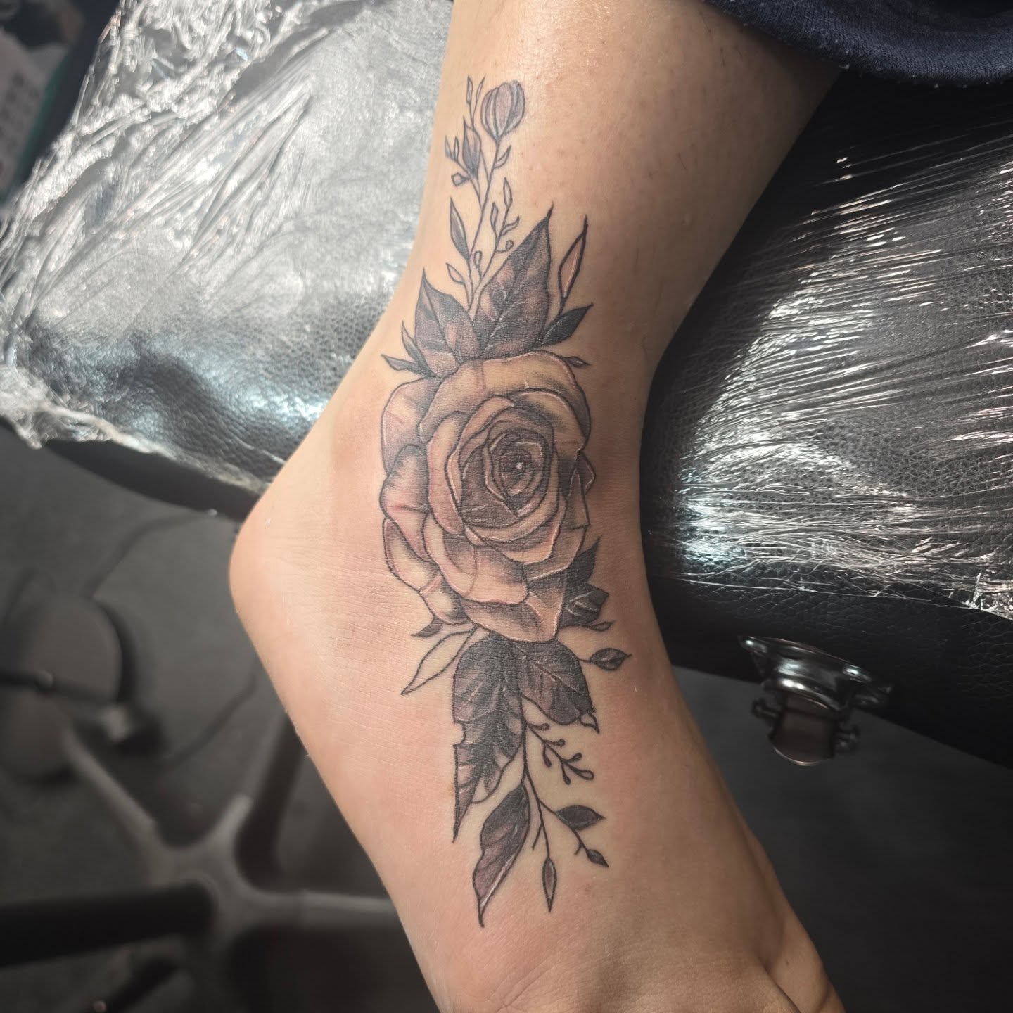 Rose black and grey tattoo on the foot by Maddox Kitson🕷