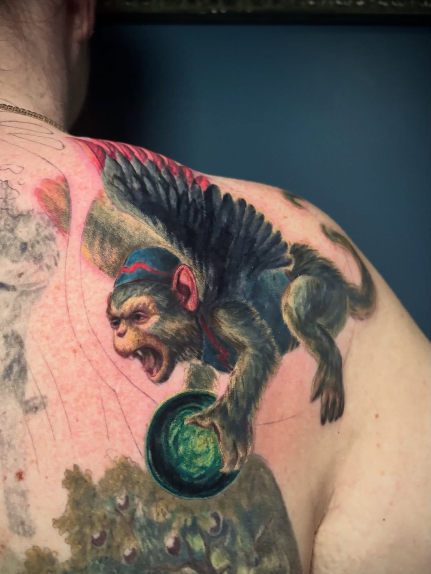 Monkey with wings realism tattoo on the shoulder by Meg Mayhem ๐จ Sarenity Tattoo