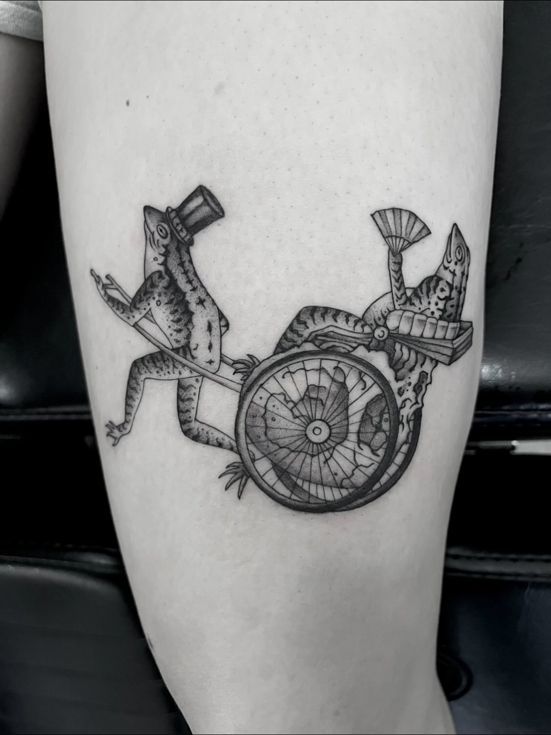 Gecko pulling cart realism tattoo on the forearm by Nathan Esteras