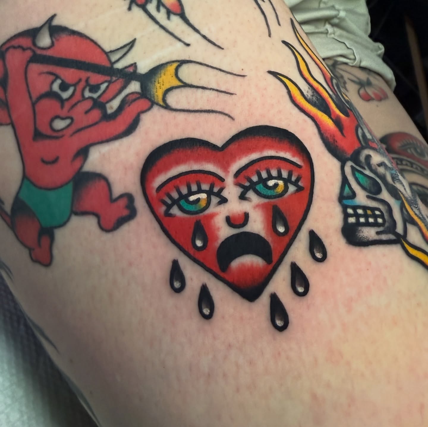 Crying heart American traditional tattoo on the thigh by Stevie Lowenstein, Cincinnati, Ohio