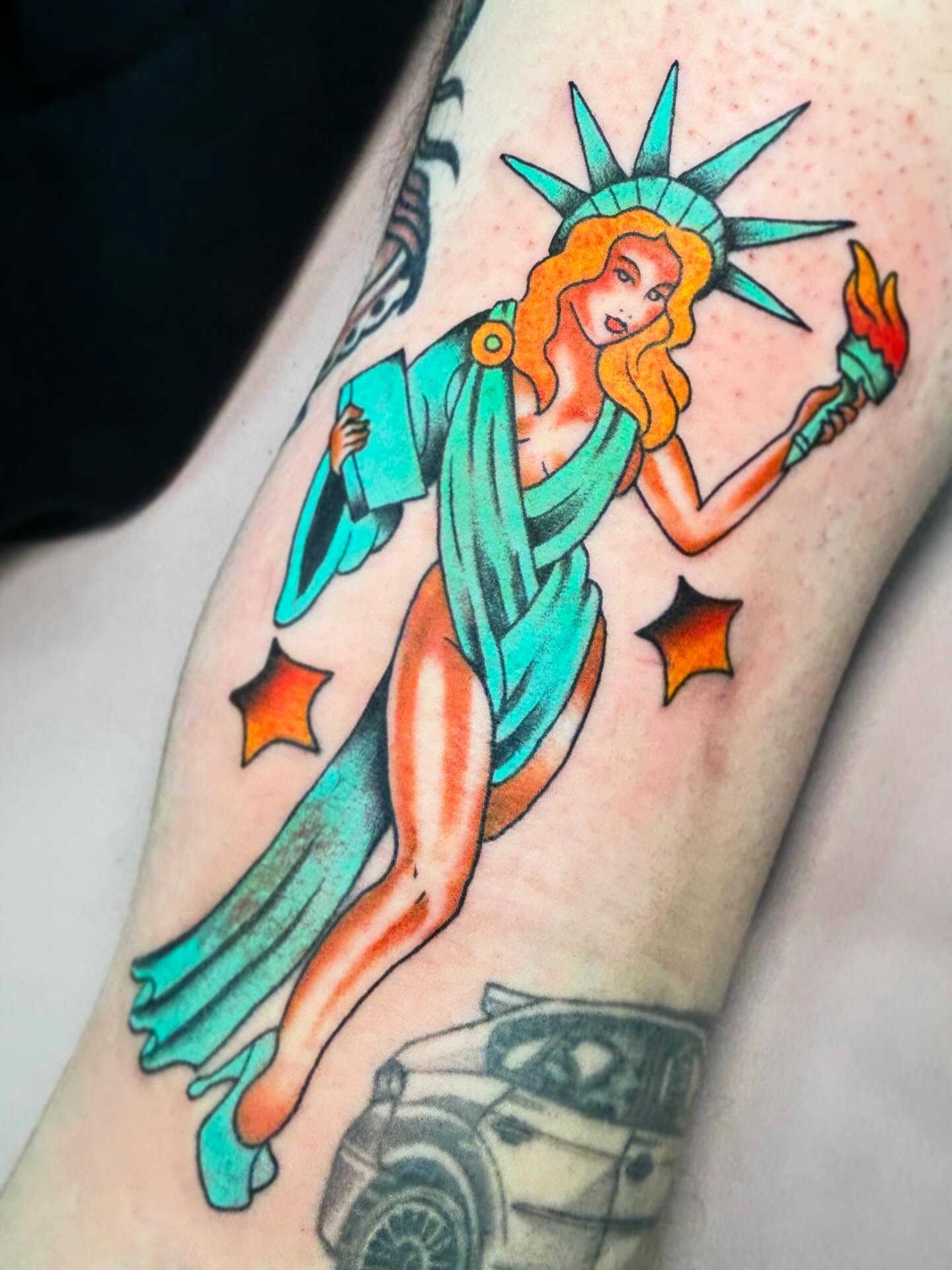 Statue of liberty pin-up American traditional tattoo on the forearm by Katie Dexter, Des Moines, Iowa