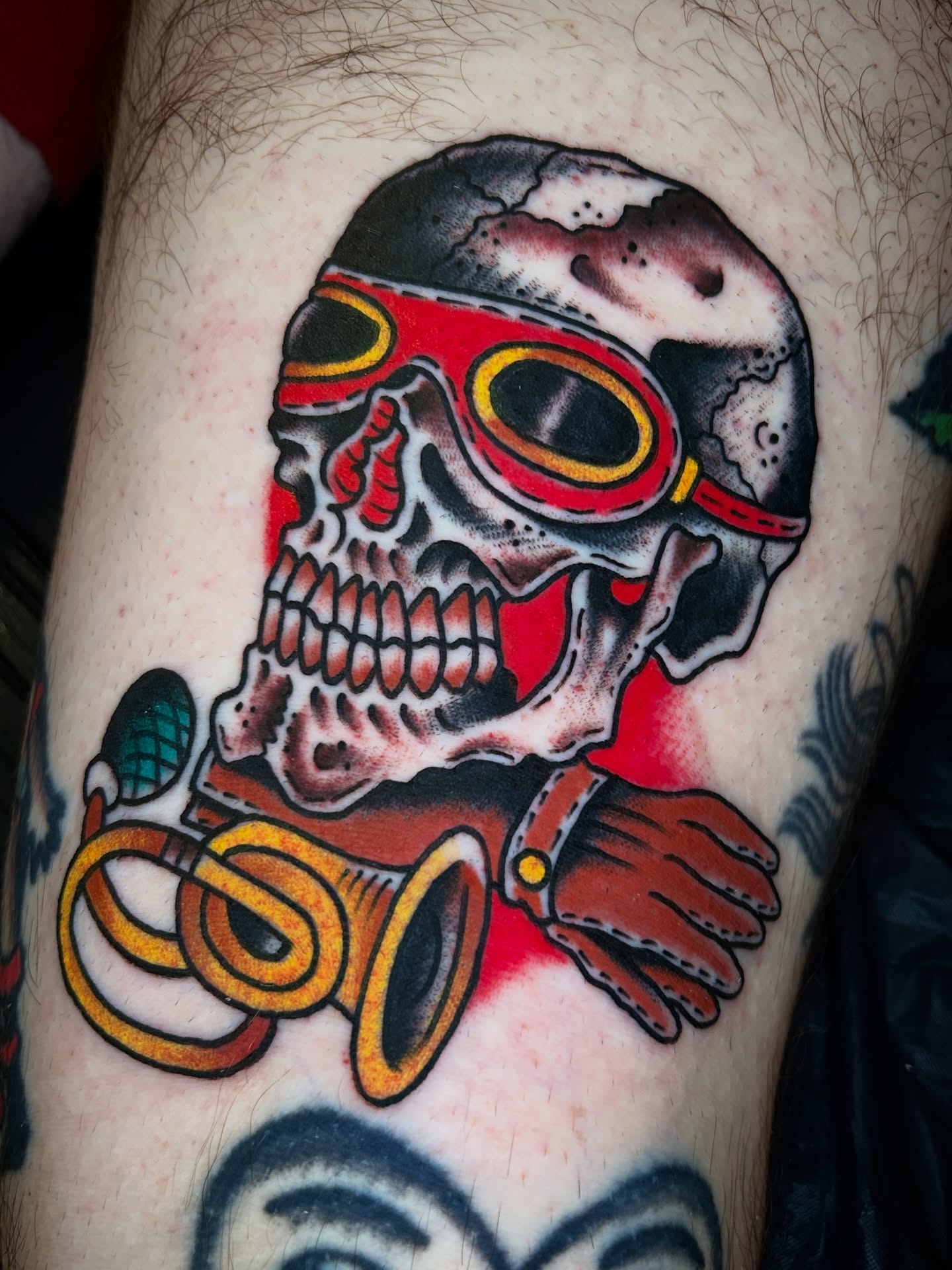Skull with goggles American traditional tattoo on the thigh by Eric Caudill, Indianapolis, Indiana