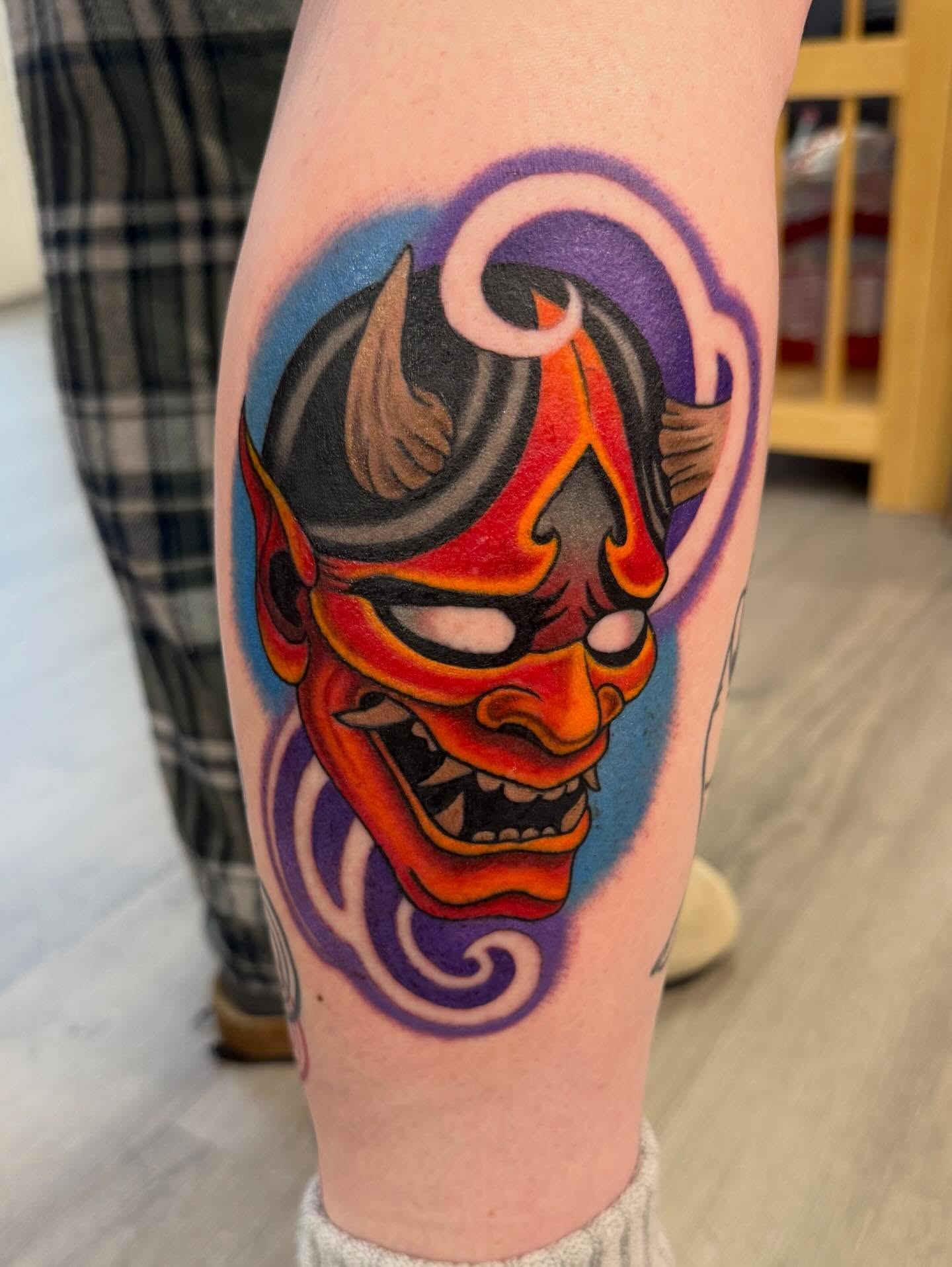 Demon mask American traditional tattoo on the forearm by Michael Joy