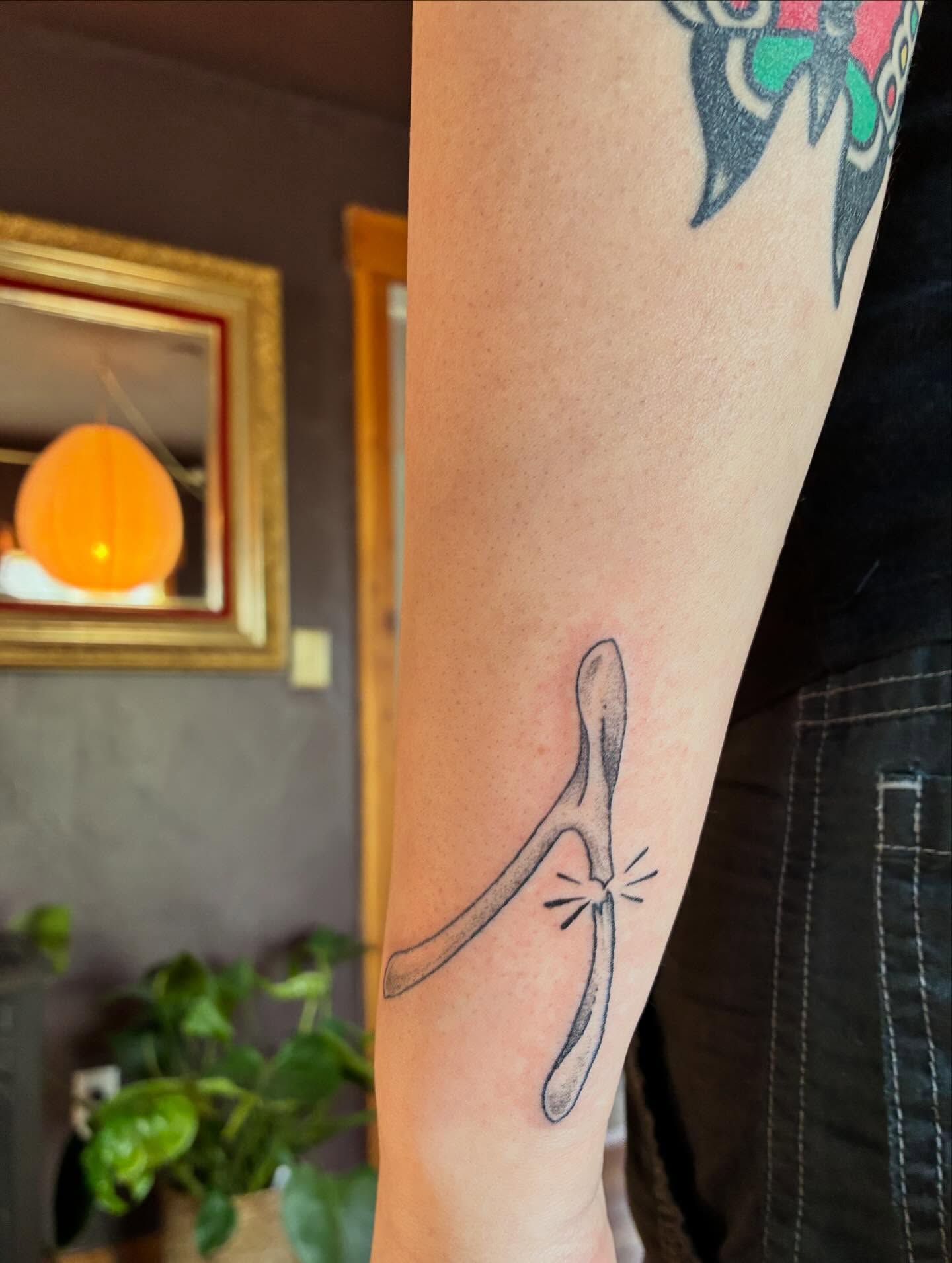 Horseshoe minimalist tattoo on the forearm by ⊹ Avery Peterson ⊹