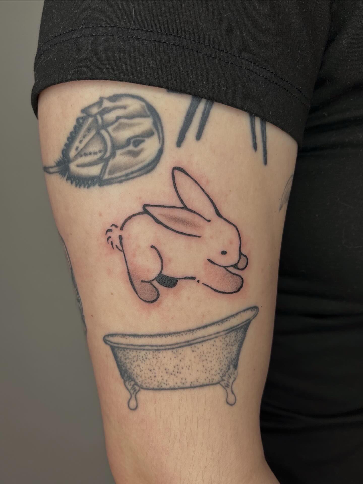 Rabbit in bathtub black and grey tattoo on the forearm by ashley π²