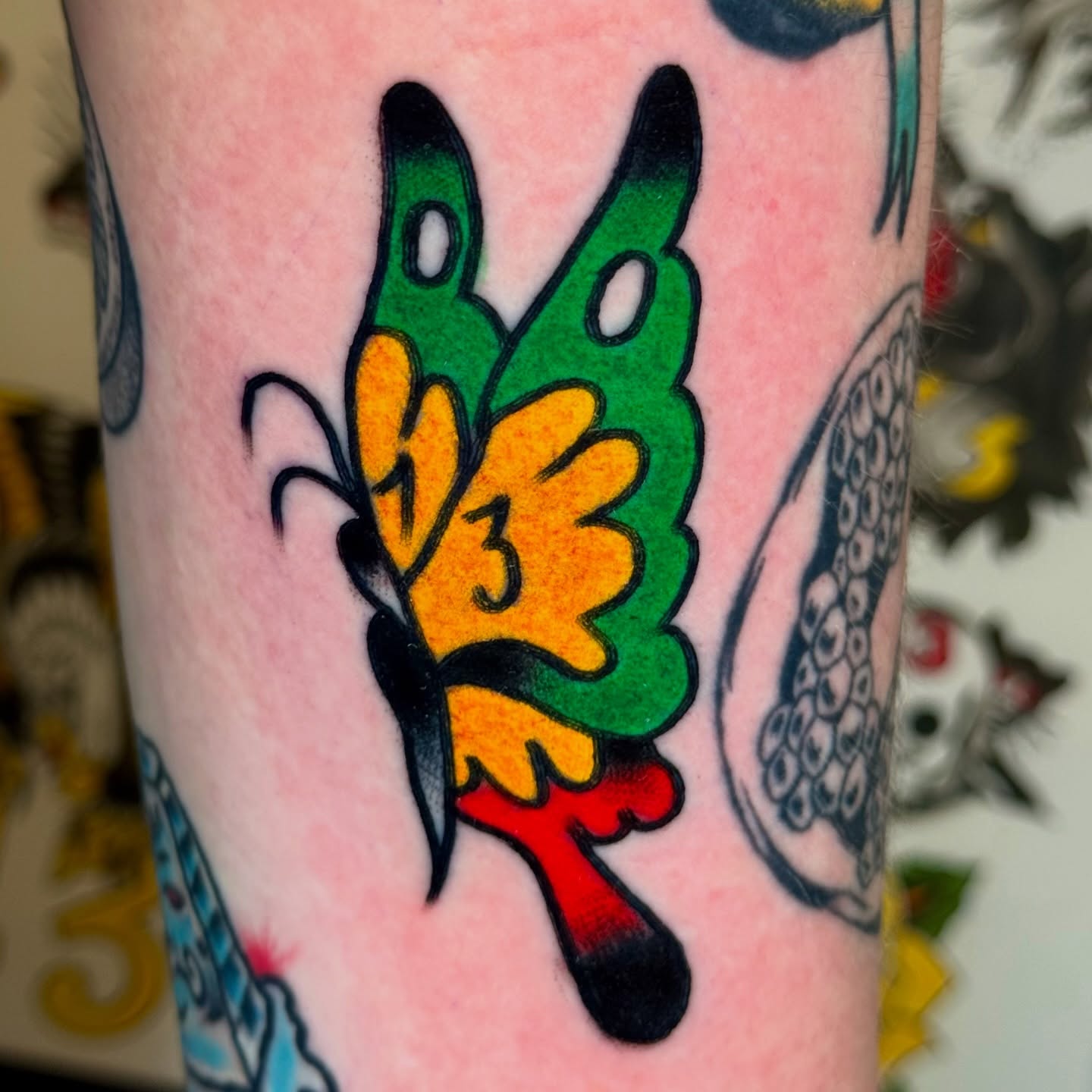 Butterfly American traditional tattoo on the forearm by Joe Bear Tattooer
