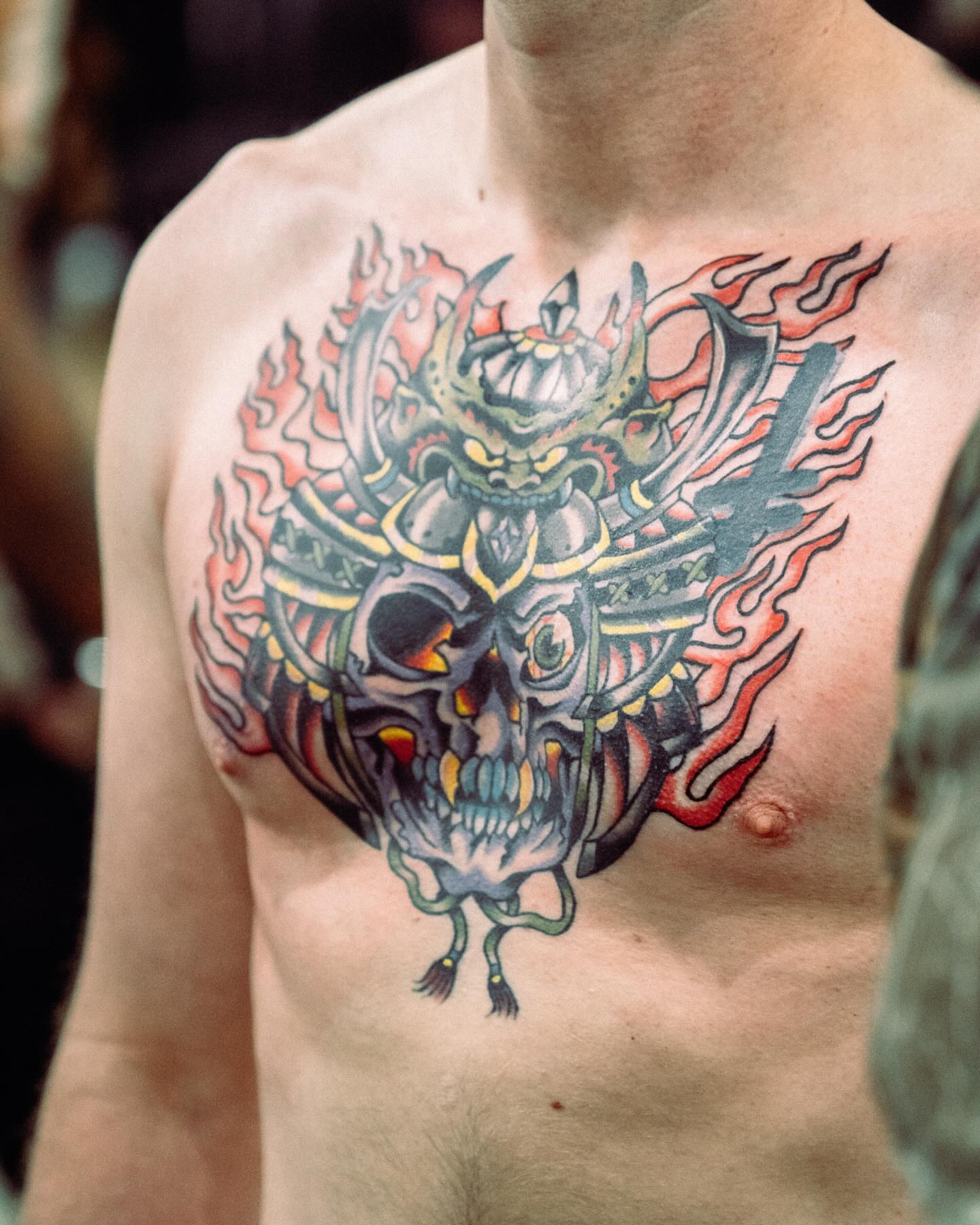 Skull with samurai helmet japanese irezumi tattoo on the chest by Ty Elias