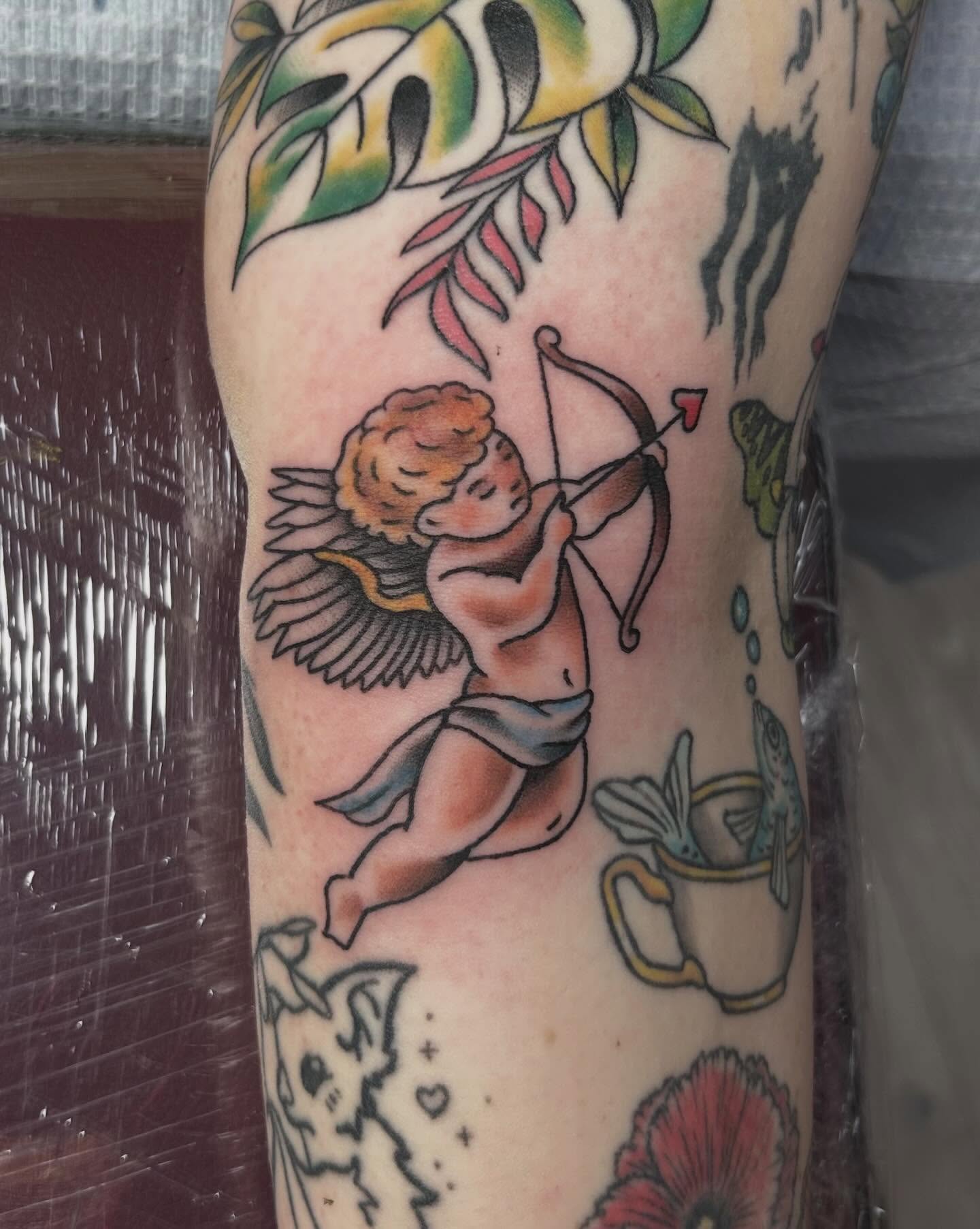 Cherub with bow American traditional tattoo on the forearm by Red✨, Gansevoort, New York