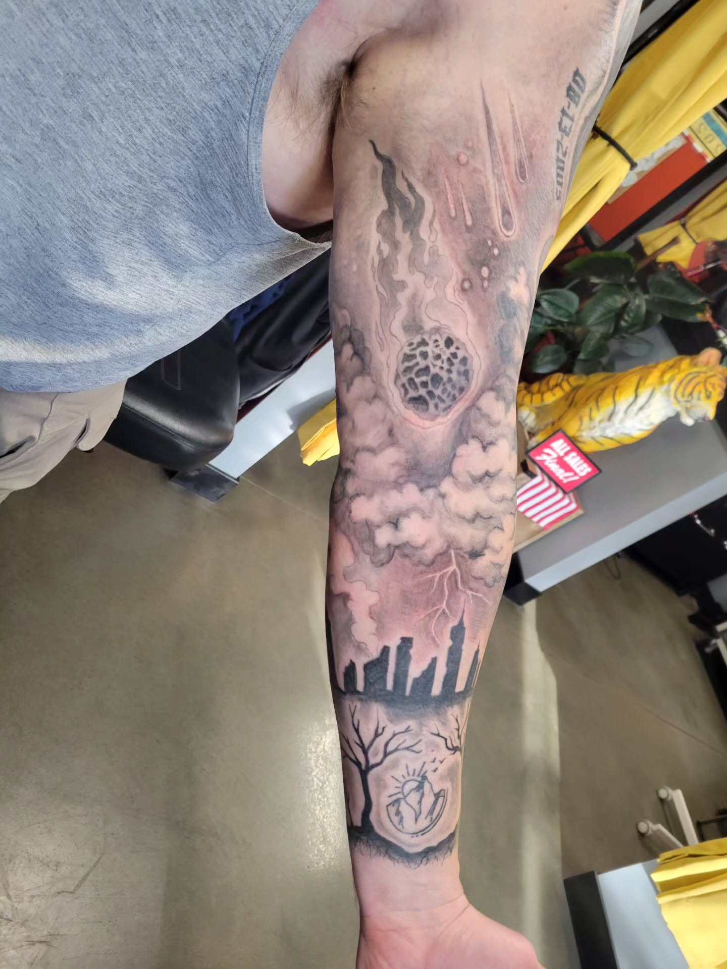 Apocalyptic cityscape realism tattoo on the forearm by Aspen C