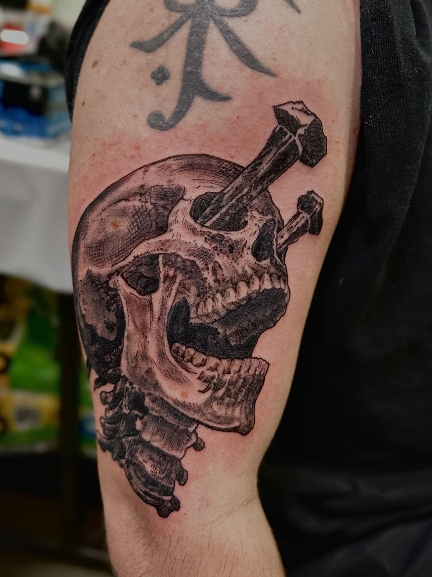 Skull with violin realism tattoo on the forearm by Mathilda Quynh