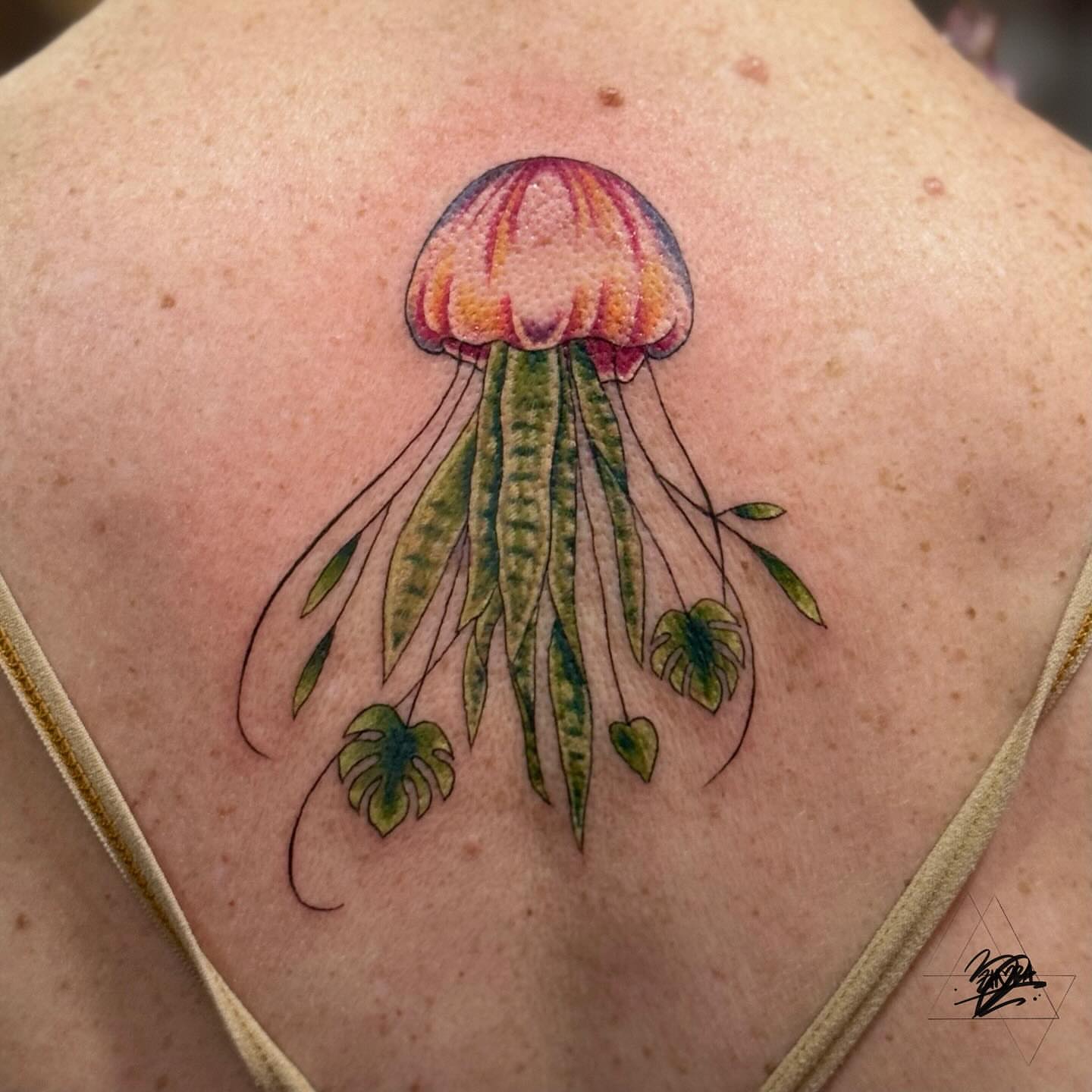 Jellyfish new school tattoo on the back by Zhorana Devi