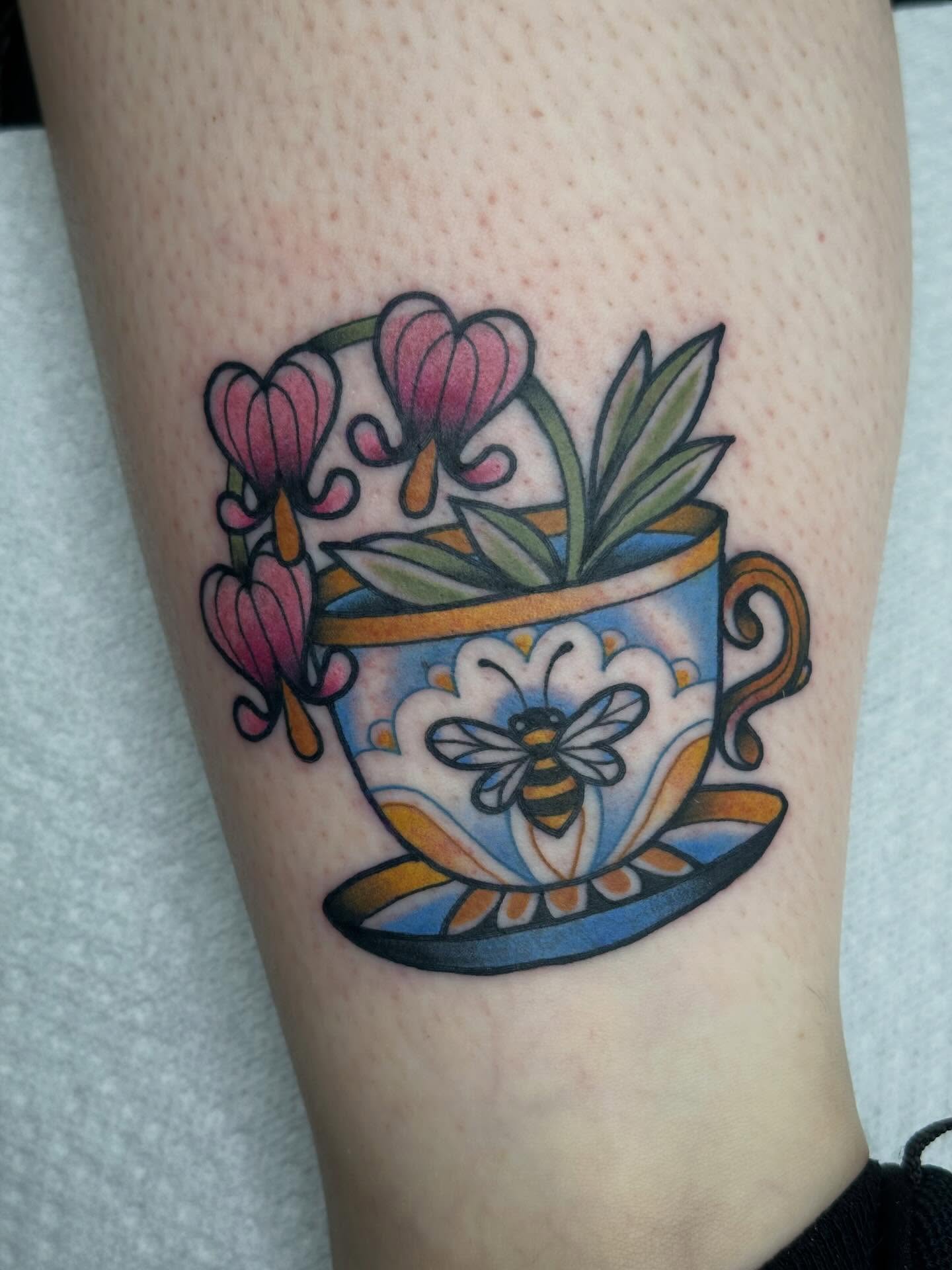 Teacup and flowers American traditional tattoo on the forearm by Ginny Marie Kalnasy