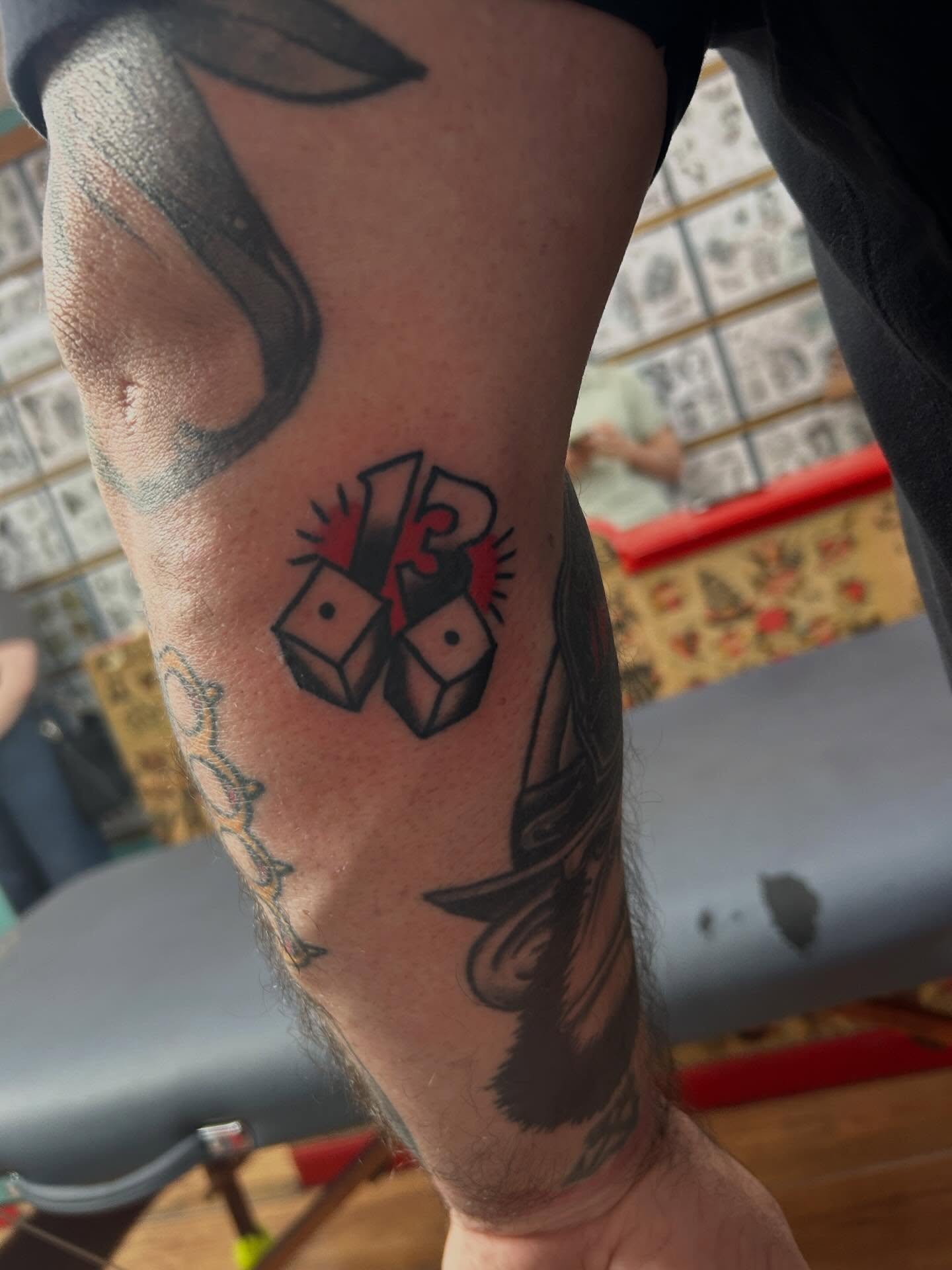 Dice and eyes American traditional tattoo on the forearm by Elizabeth Niederkorn